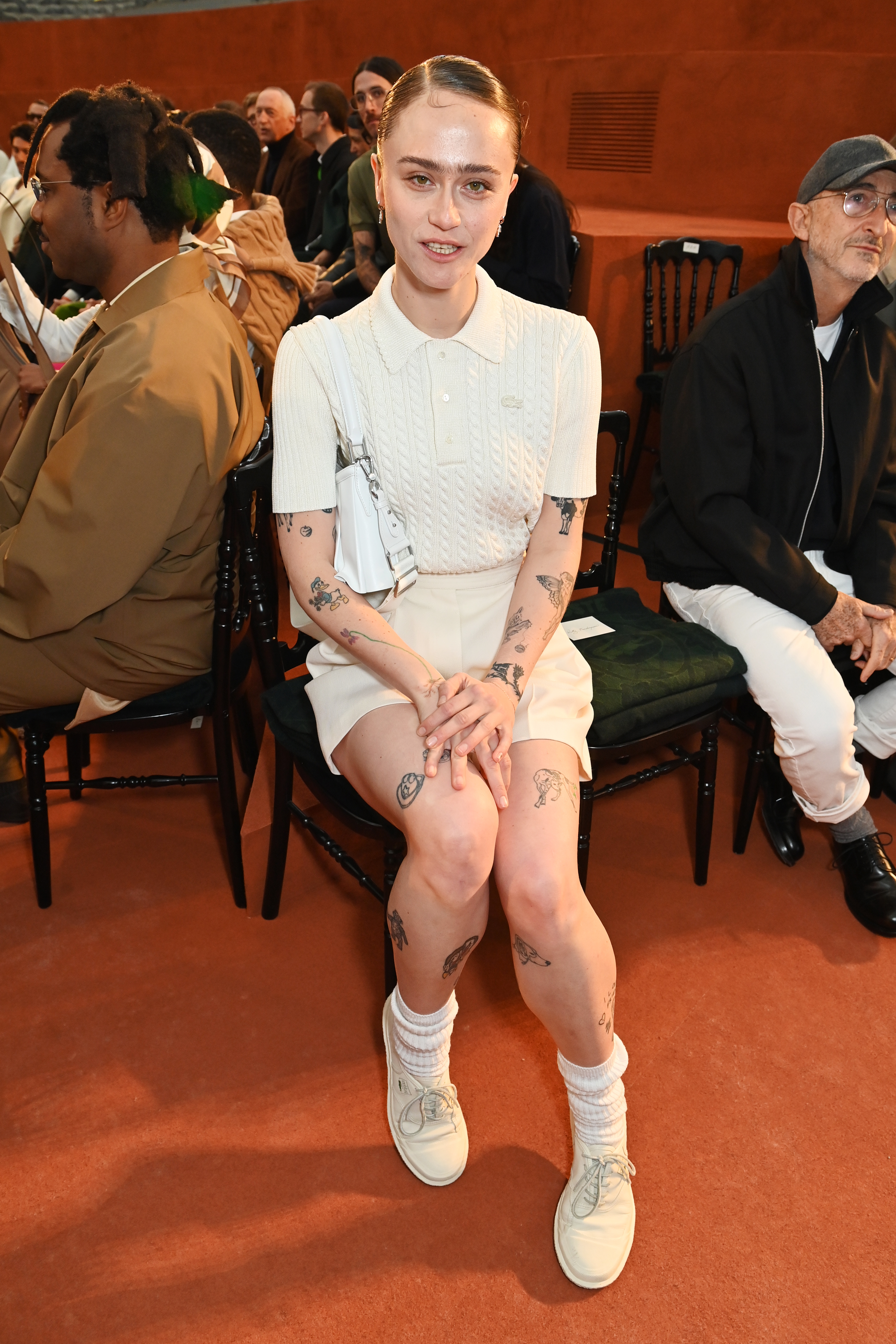 Ella Emhoff seated at the Lacoste fashion show. | Source: Getty Images