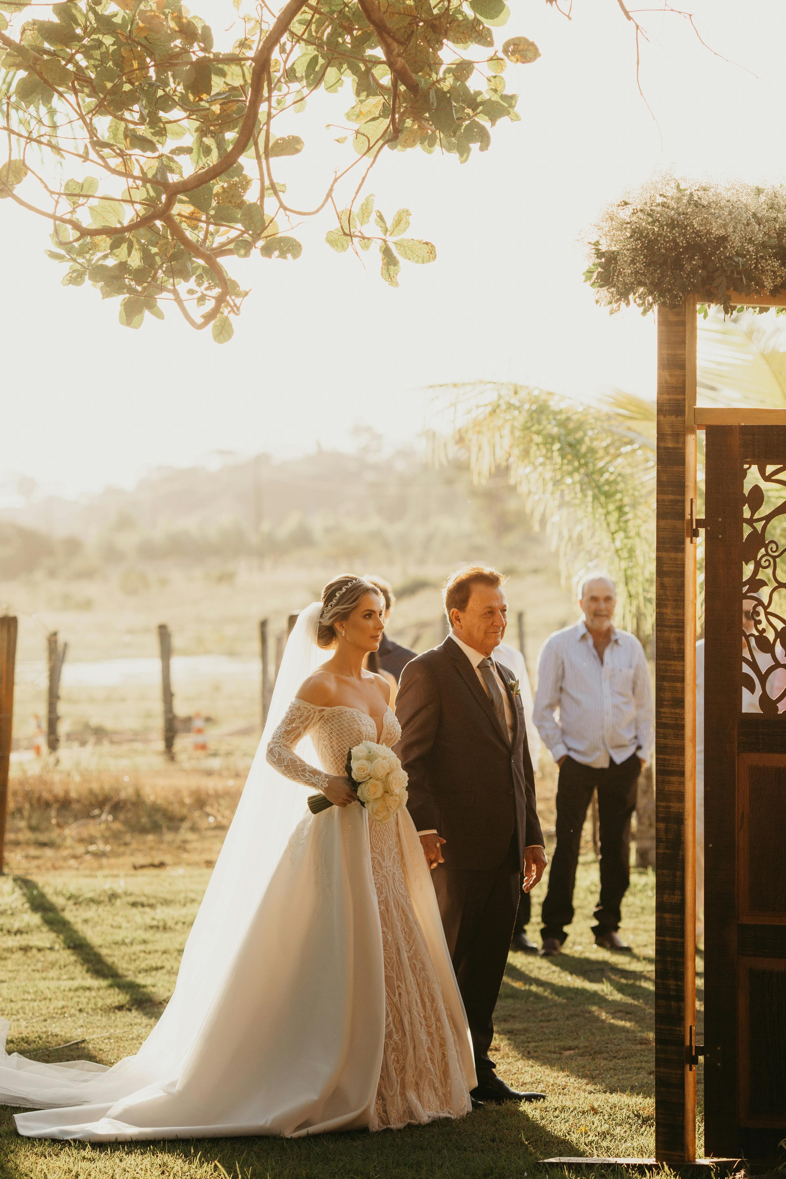 A bride and her father walking down the aisle | Source: Pexels