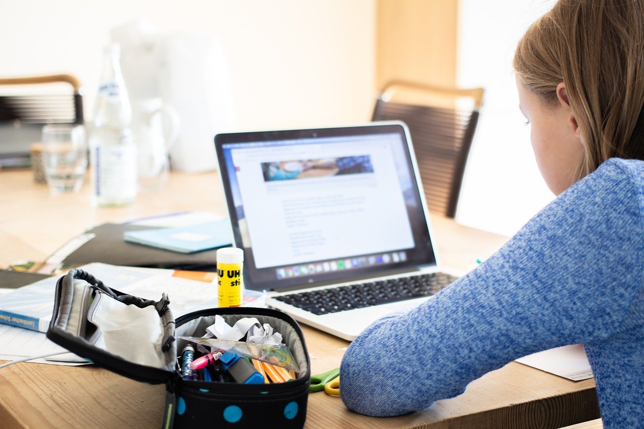 A photo of a girl in front of a laptop while attending her online class. | Photo: Pixabay