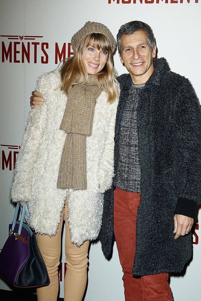 Nagui et sa femme Melanie Page assistent à la première de "Monuments Men" au Cinéma UGC Normandie le 12 février 2014 à Paris, France. | Photo : Getty Images
