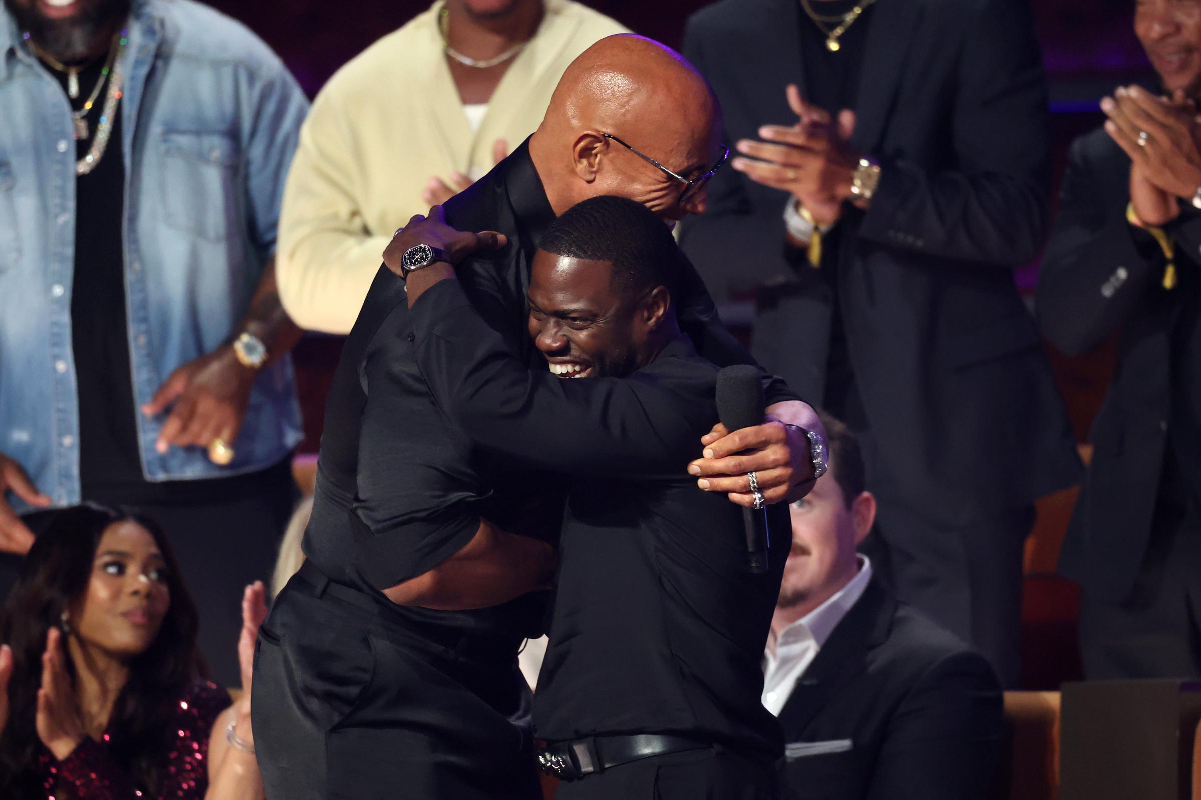 Dwayne Johnson and Kevin Hart are seen onstage during Netflix Is A Joke Festival Presents: The Roast of Kevin Hart at The Kia Forum on May 10, 2026, in Inglewood, California | Source: Getty Images