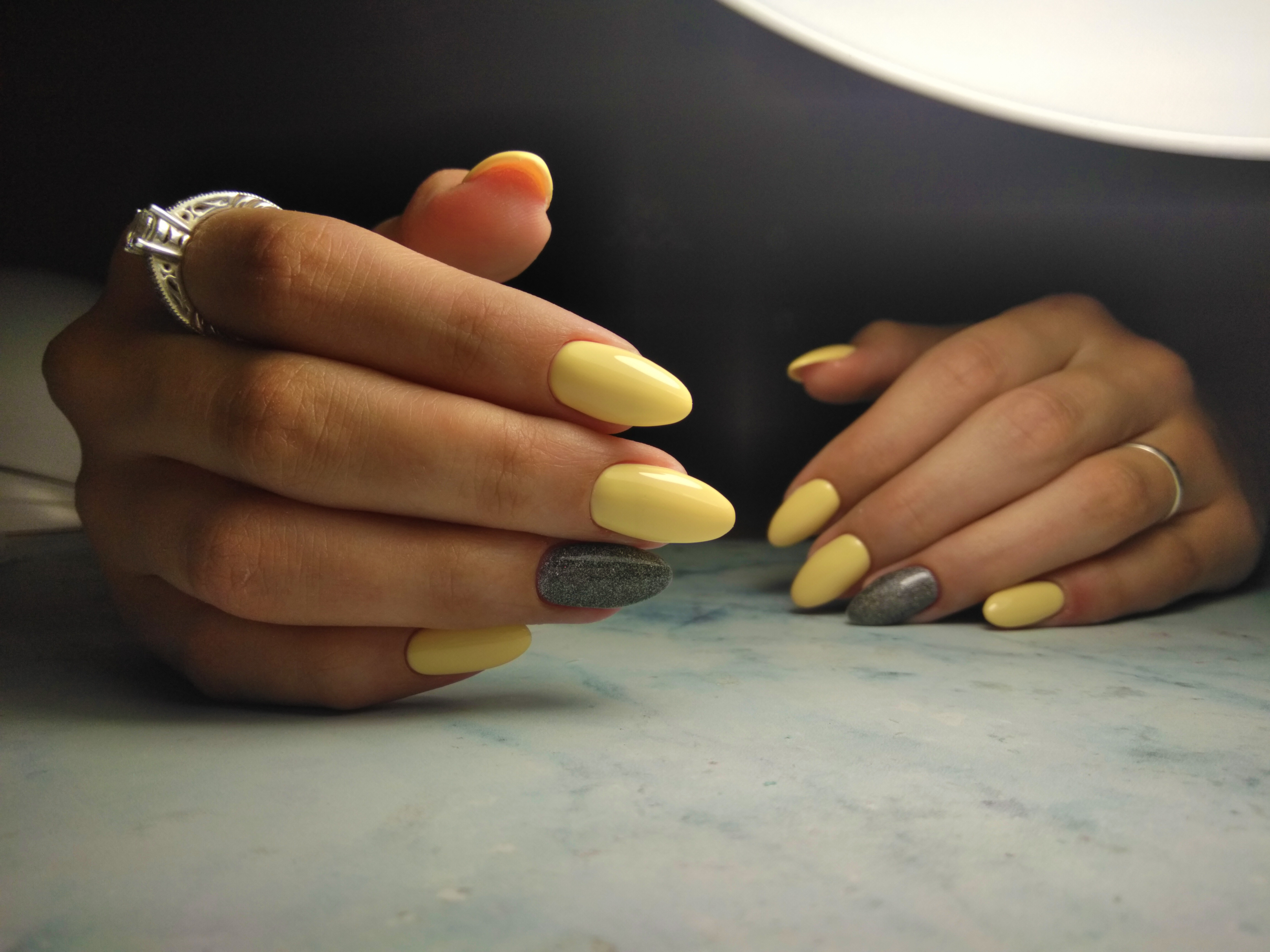 Yellow and gray accent nails. | Source: Getty Images