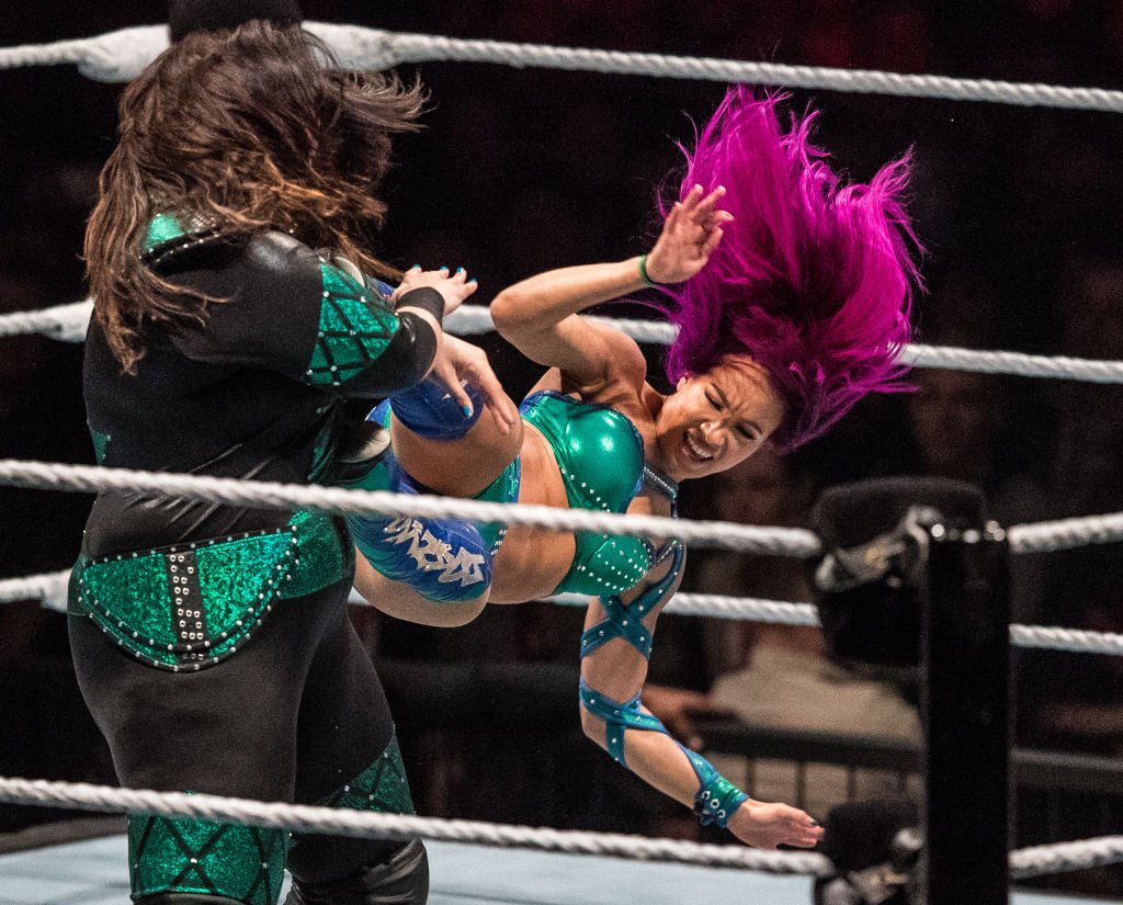 Sasha Banks (R) attacks Nia Jax (L) during to the WWE Live Duesseldorf event at ISS Dome on February 22, 2017, in Duesseldorf, Germany. | Source: Getty Images