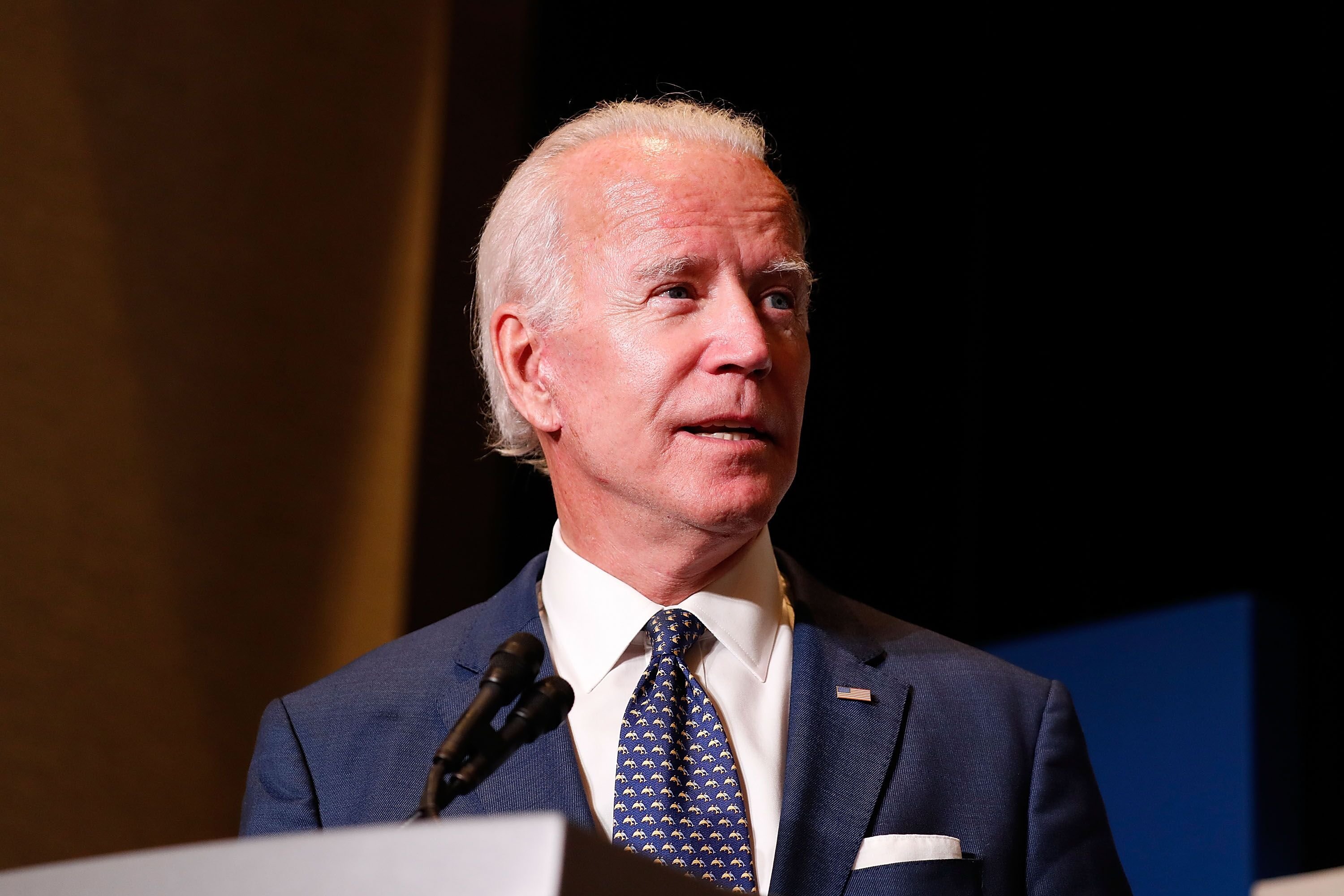 Joe Biden speaks on stage before an audience. | Source: Getty Images