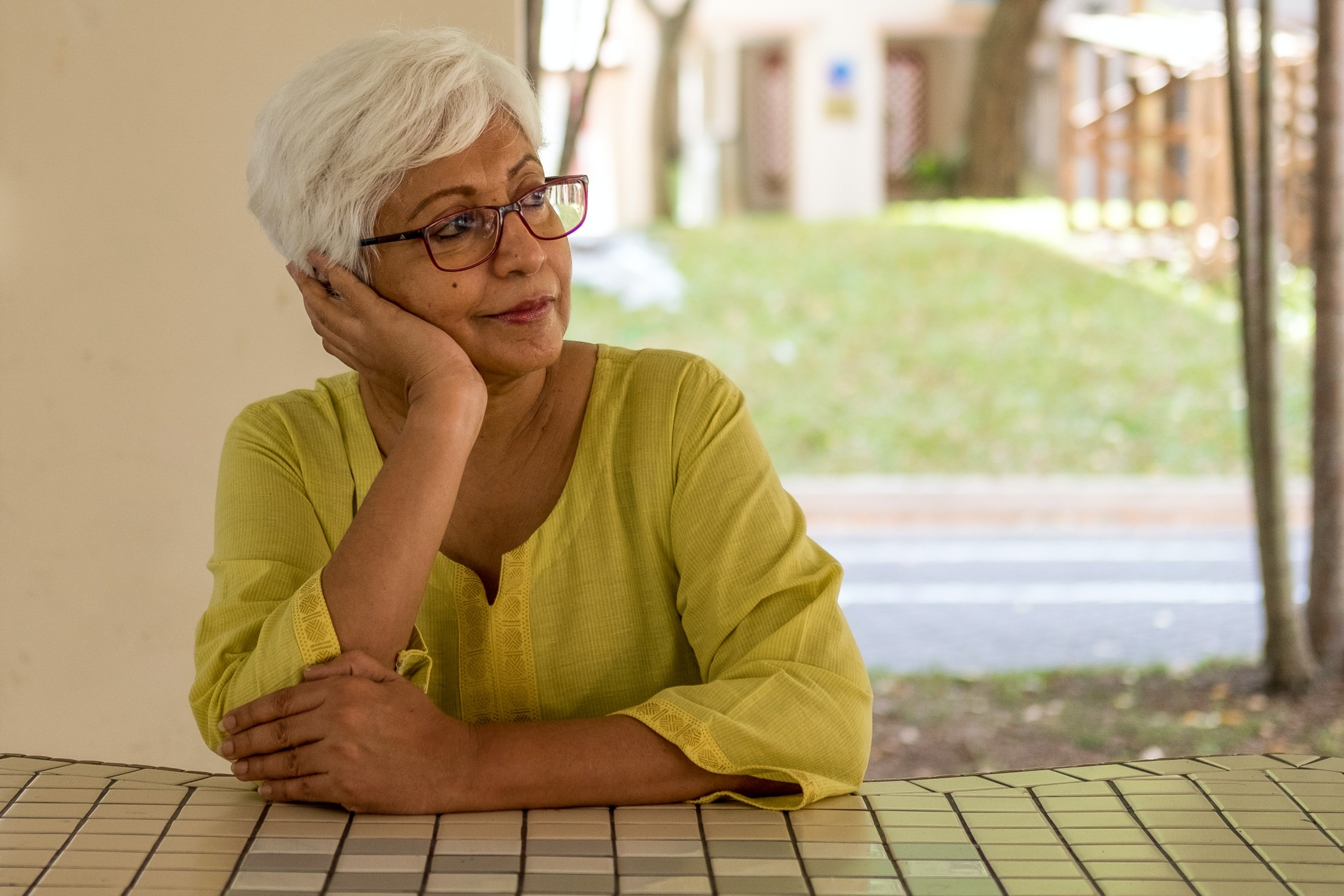 Woman wearing a yellow shirt | Source: Unsplash /  BBH Singapore