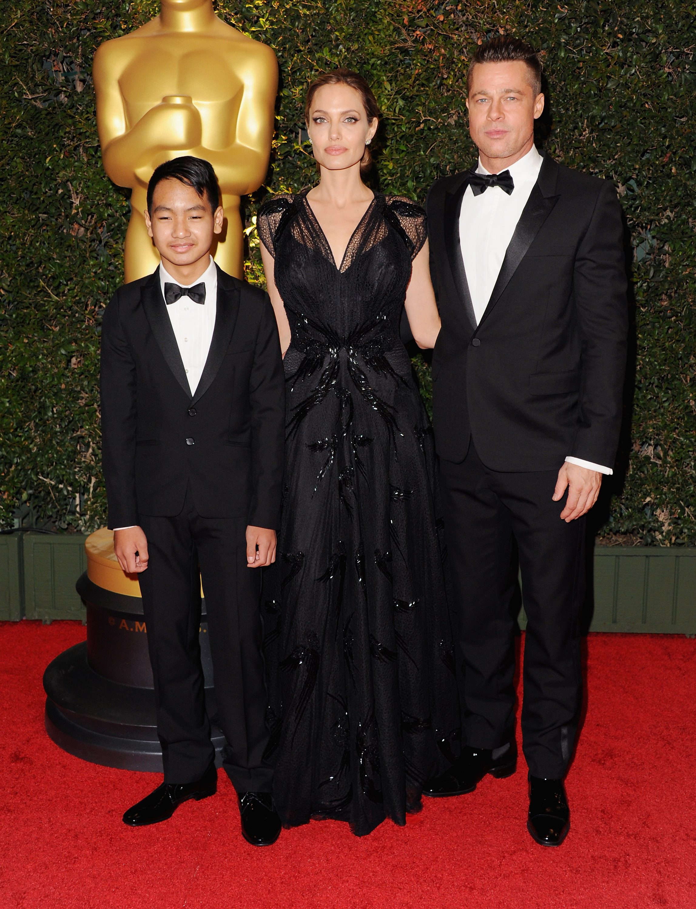 Maddox, Angelina Jolie, and Brad Pitt at the Governor Awards in Hollywood, California on November 16, 2013. | Source: Getty Images
