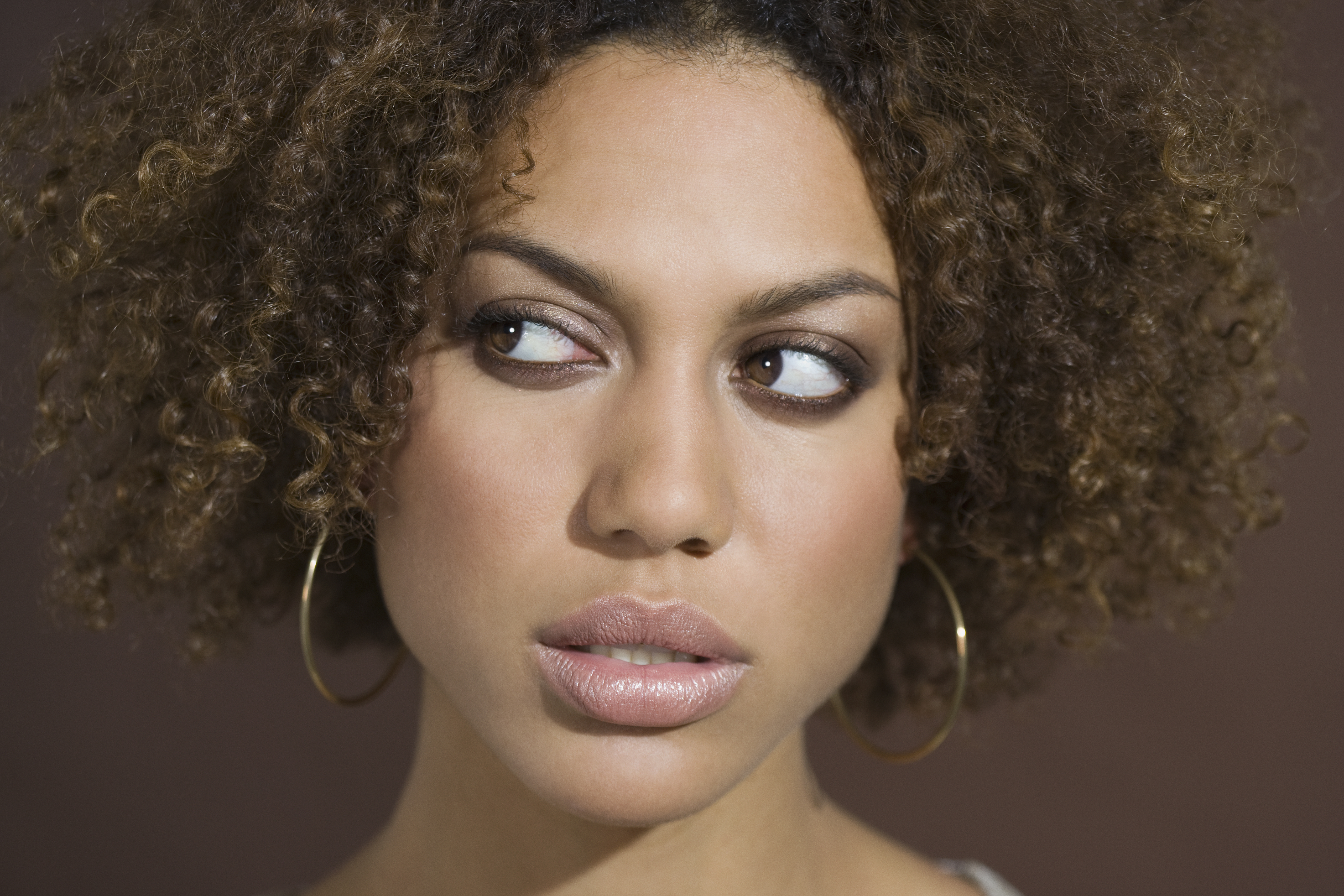 Mixed Race woman looking sideways | Source: Getty Images