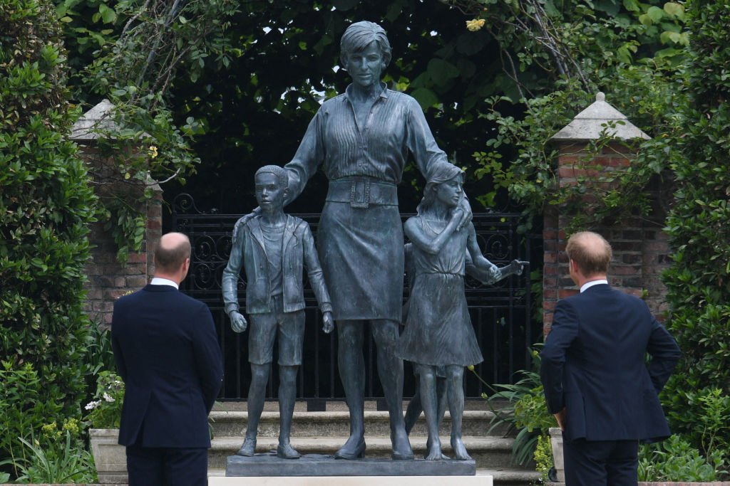 Prince William and Prince Harry unveil a statue of their mother, Princess Diana at The Sunken Garden in Kensington Palace on July 1, 2021, London | Photo: Getty Images