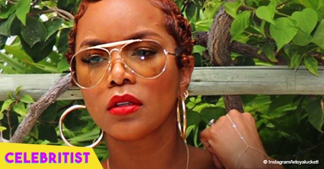 LeToya Luckett flaunts her growing baby bump in green lace swimsuit