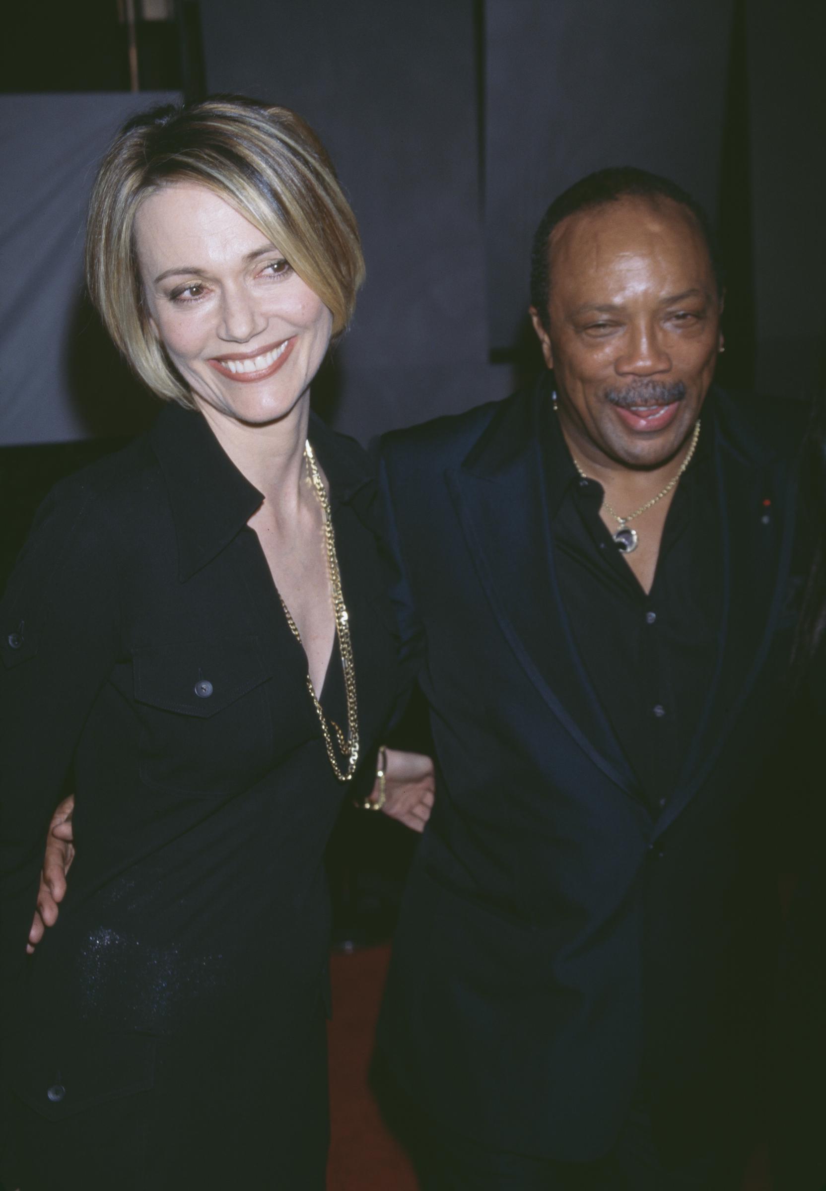 American record producer Quincy Jones with actress and model Peggy Lipton in Hollywood, California, circa 1996 | Source: Getty Images