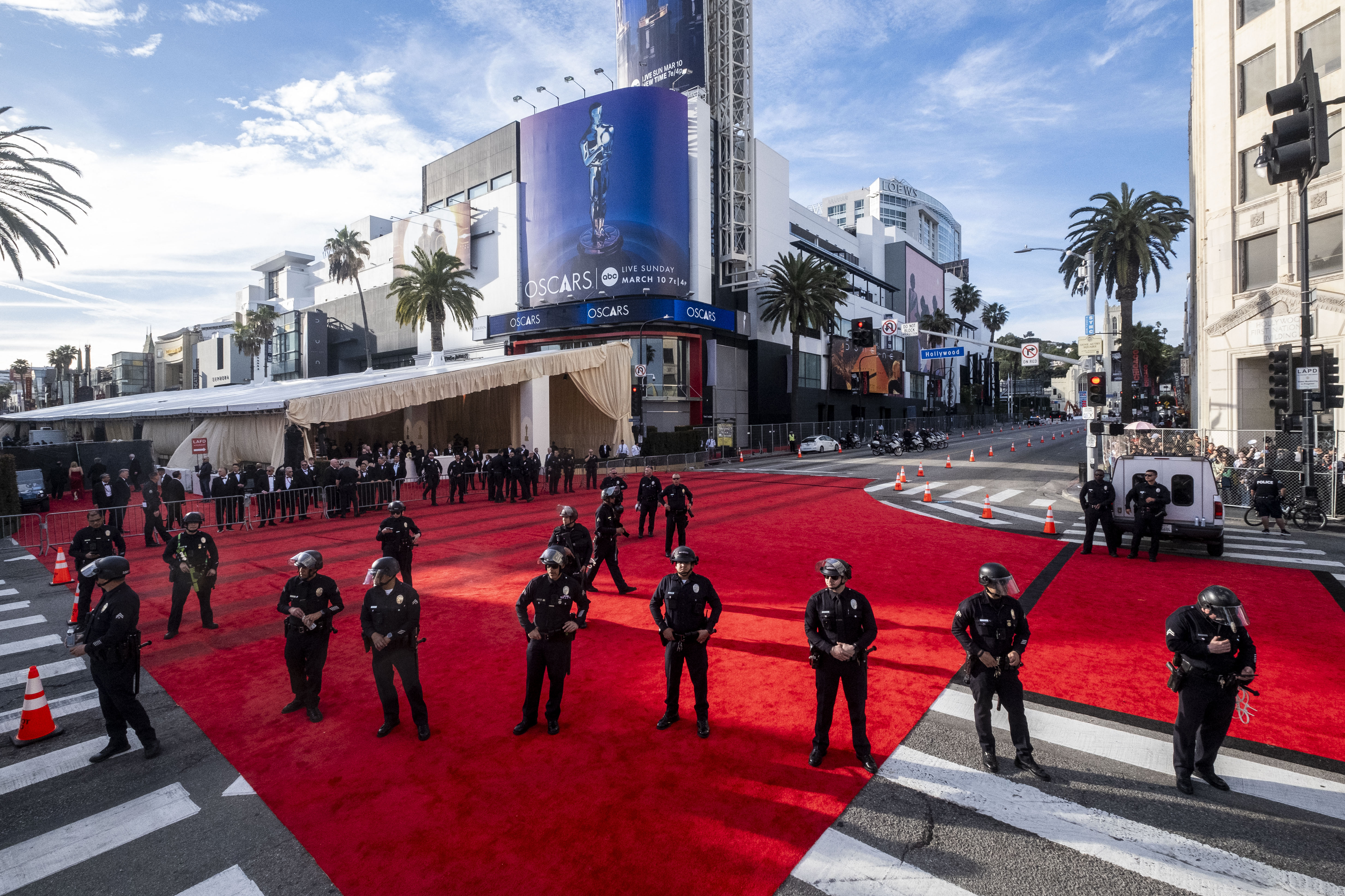 Police officers stand guard at the red carpet area following pro-Palestinian demonstrations near the Dolby Theatre during the 96th Academy Awards in Hollywood, California, on March 10, 2024 | Source: Getty Images