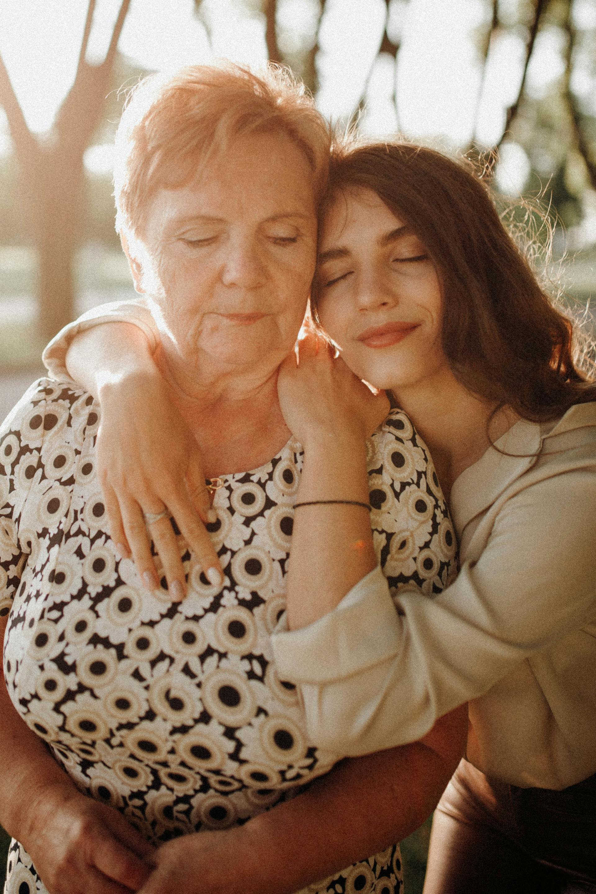 A daughter with her arms around her mother | Source: Pexels
