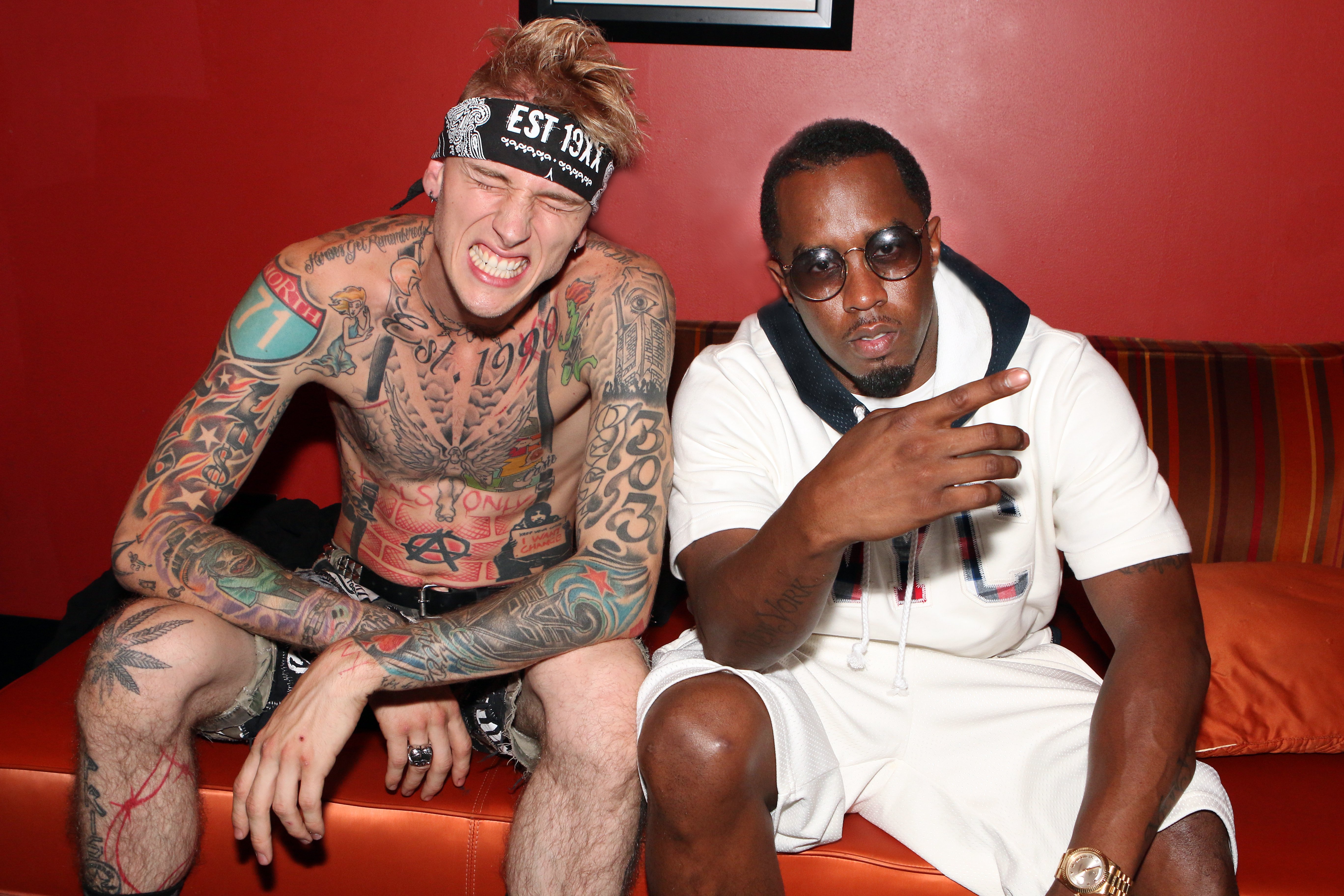  Sean 'Diddy' Combs poses with Machine Gun Kelly, who featured his "WEST 303" tattoo on his left arm. | Source: Getty Images