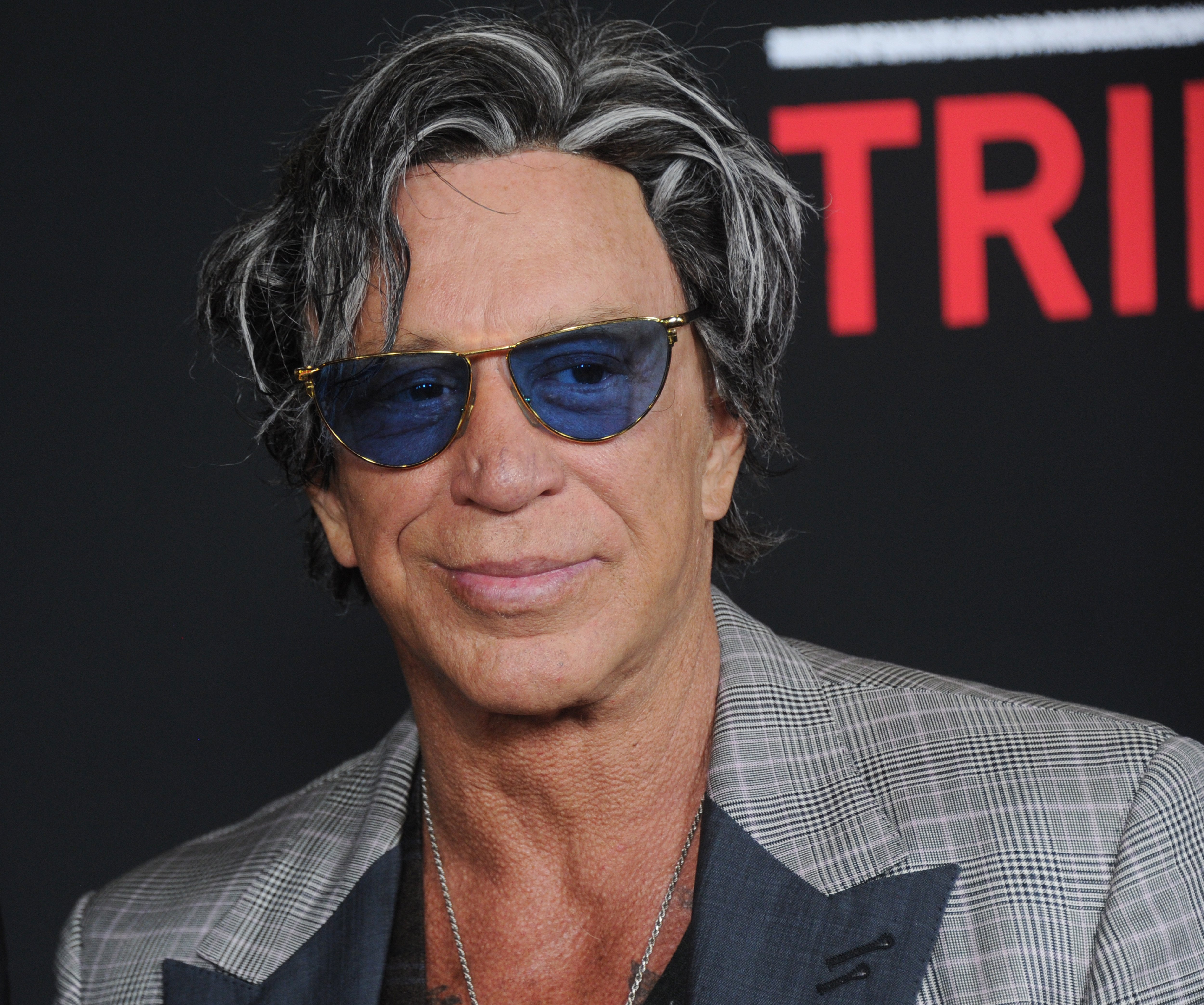 Actor Mickey Rourke arrives at the premiere of Open Road's "Triple 9" at Regal Cinemas L.A. Live on February 16, 2016 in Los Angeles, California. | Source: Getty Images