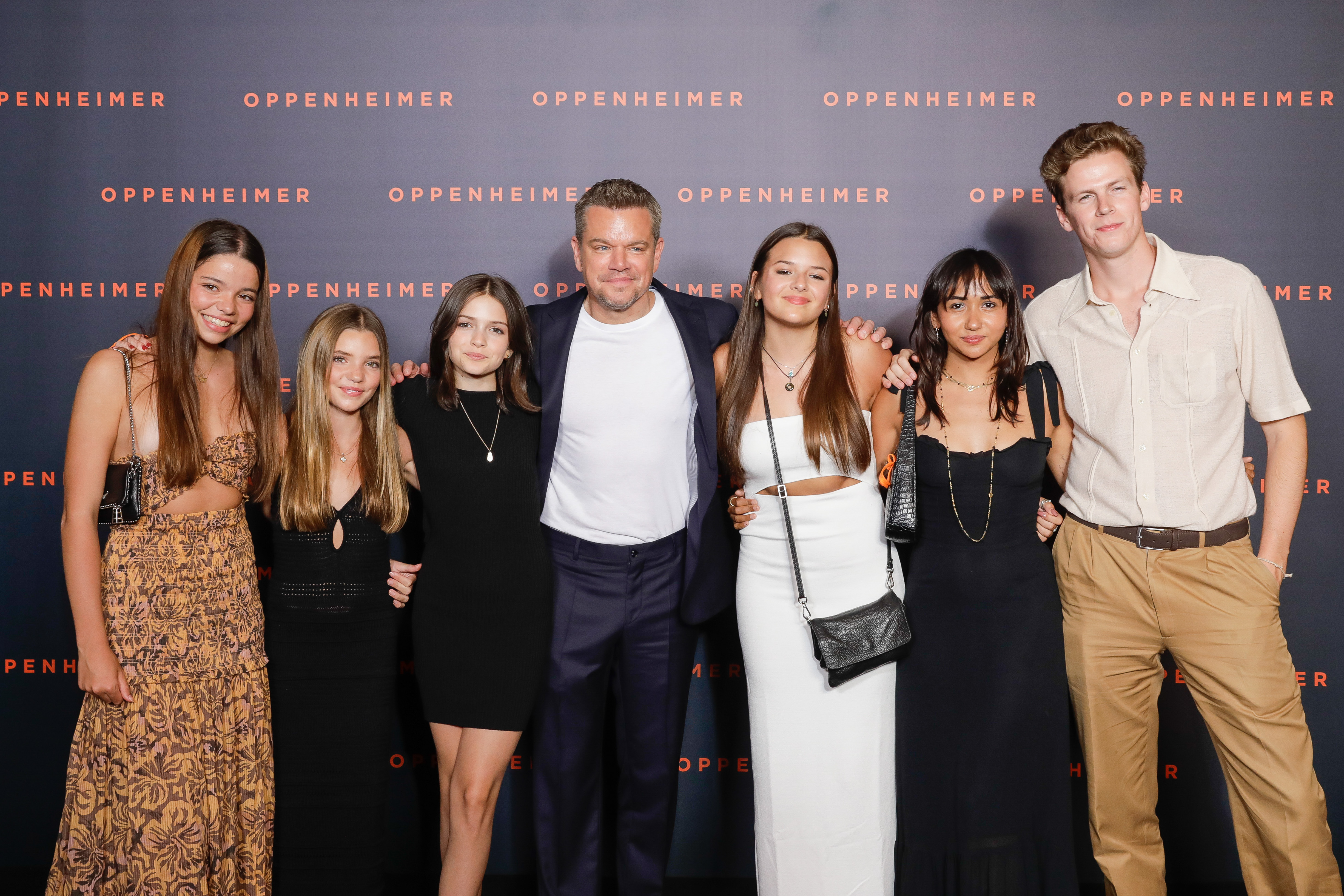 Matt Damon joins daughters Alexia Barroso, Isabella Damon, Gia Damon, and Stella Damon on the red carpet at the Paris premiere of "Oppenheimer." | Source: Getty Images