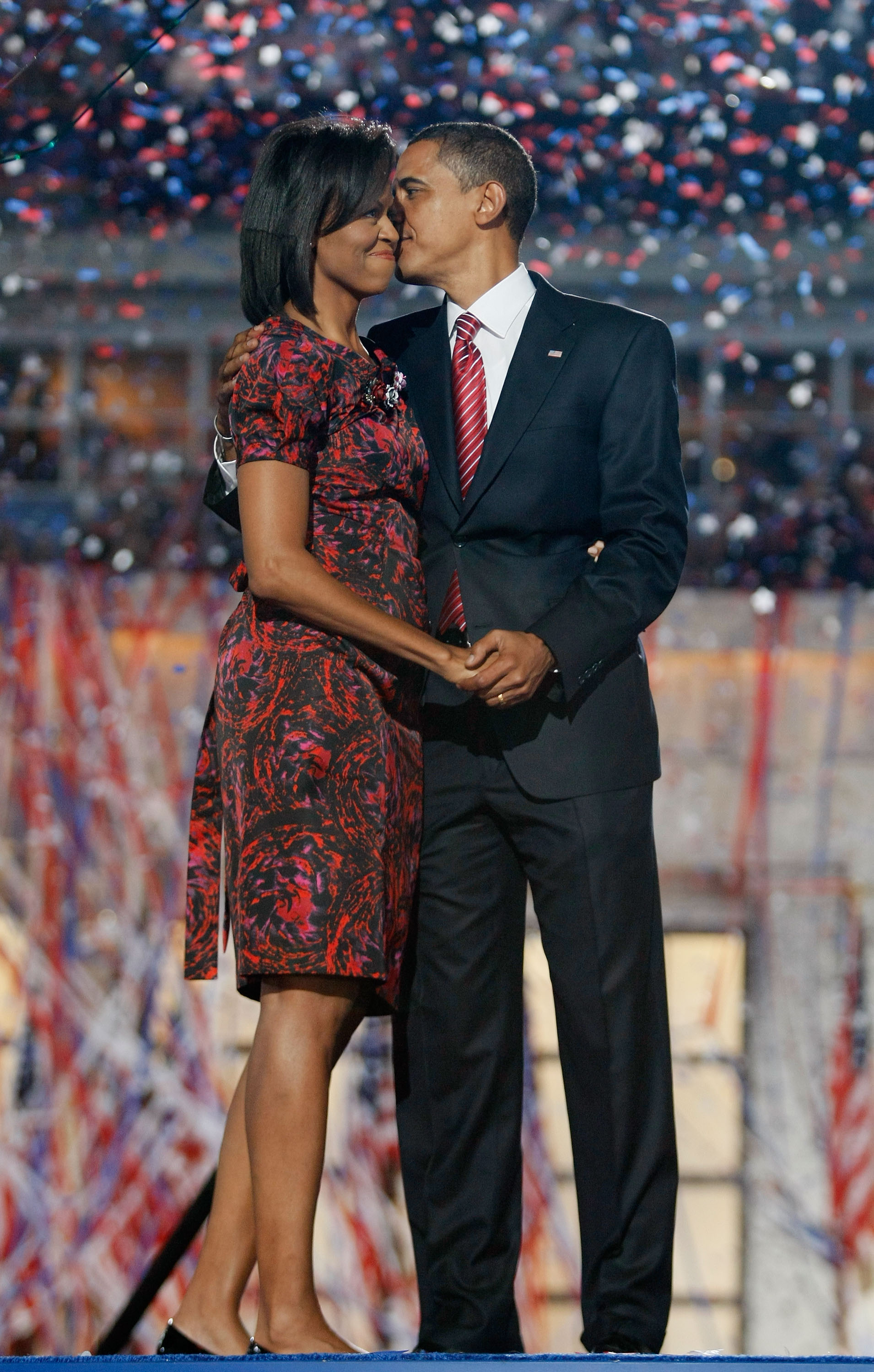 Michelle and Barack Obama after his speech on day four of the Democratic National Convention (DNC) at Invesco Field at Mile High on August 28, 2008, in Denver, Colorado. | Source: Getty Images