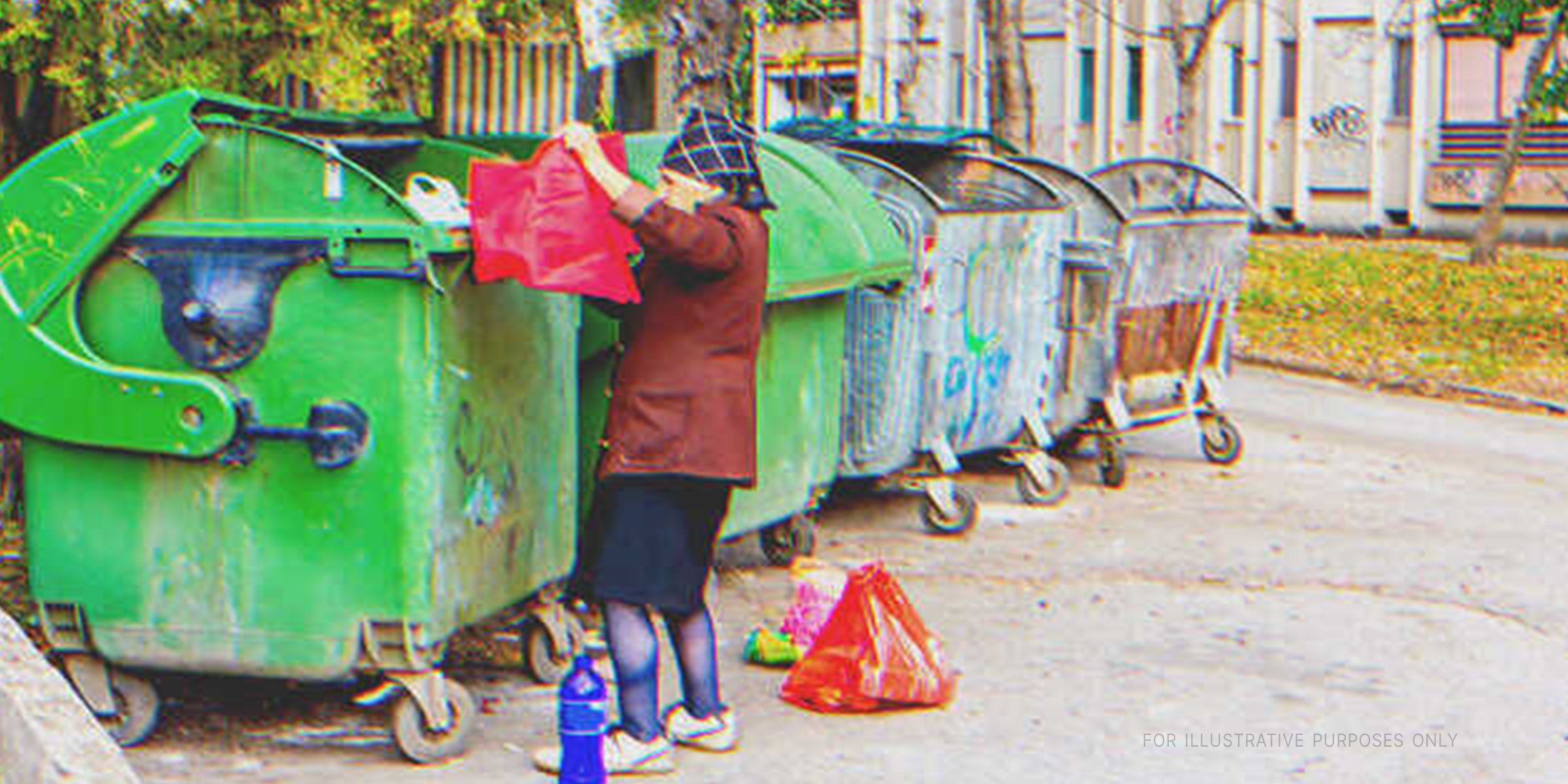 Older woman digging through a dumpster | Source: Shutterstock