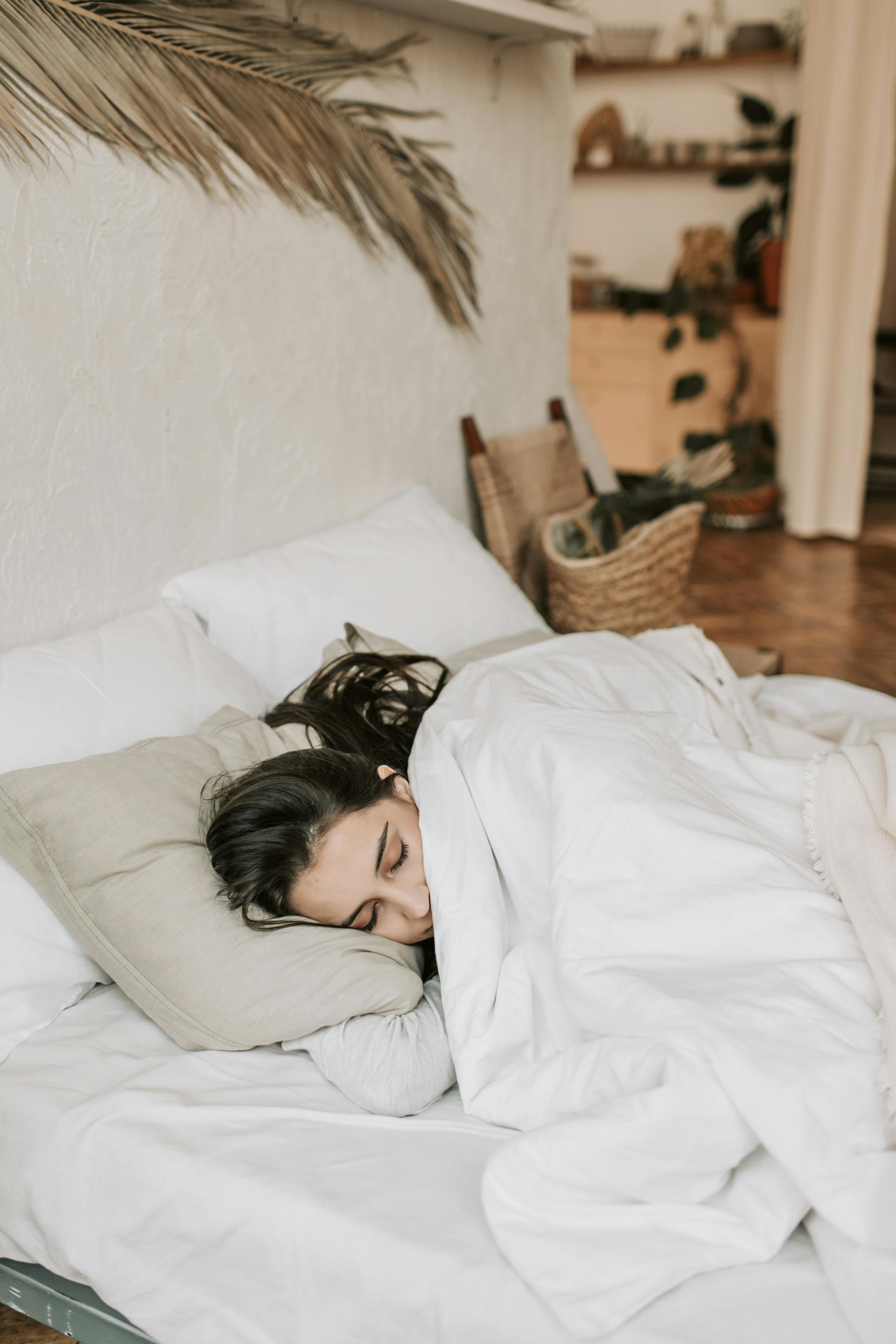 A woman sleeping in bed | Source: Pexels
