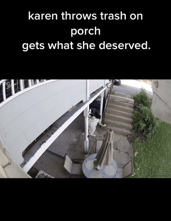 A woman attempting to throw trash on a neighbor's porch. | Photo: tiktok.com/@neighborhood.wars