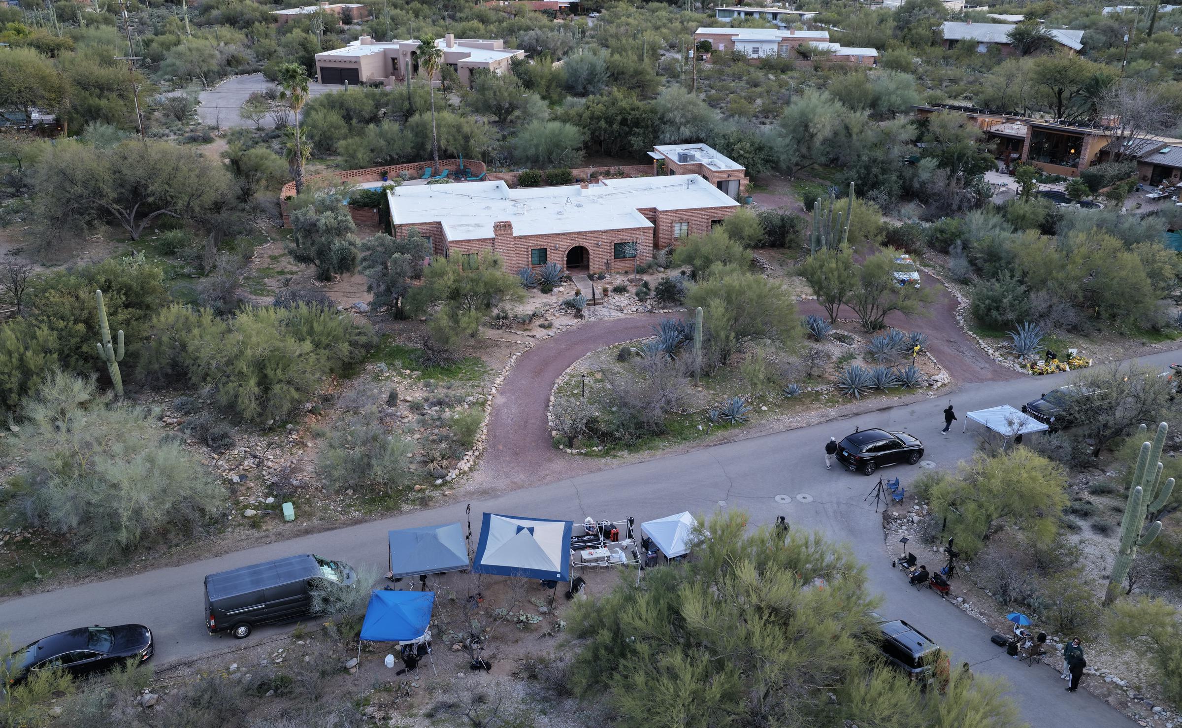 An aerial view shows Nancy Guthrie's Tucson home and surrounding neighborhood as media gather nearby on February 18, 2026 | Source: Getty Images