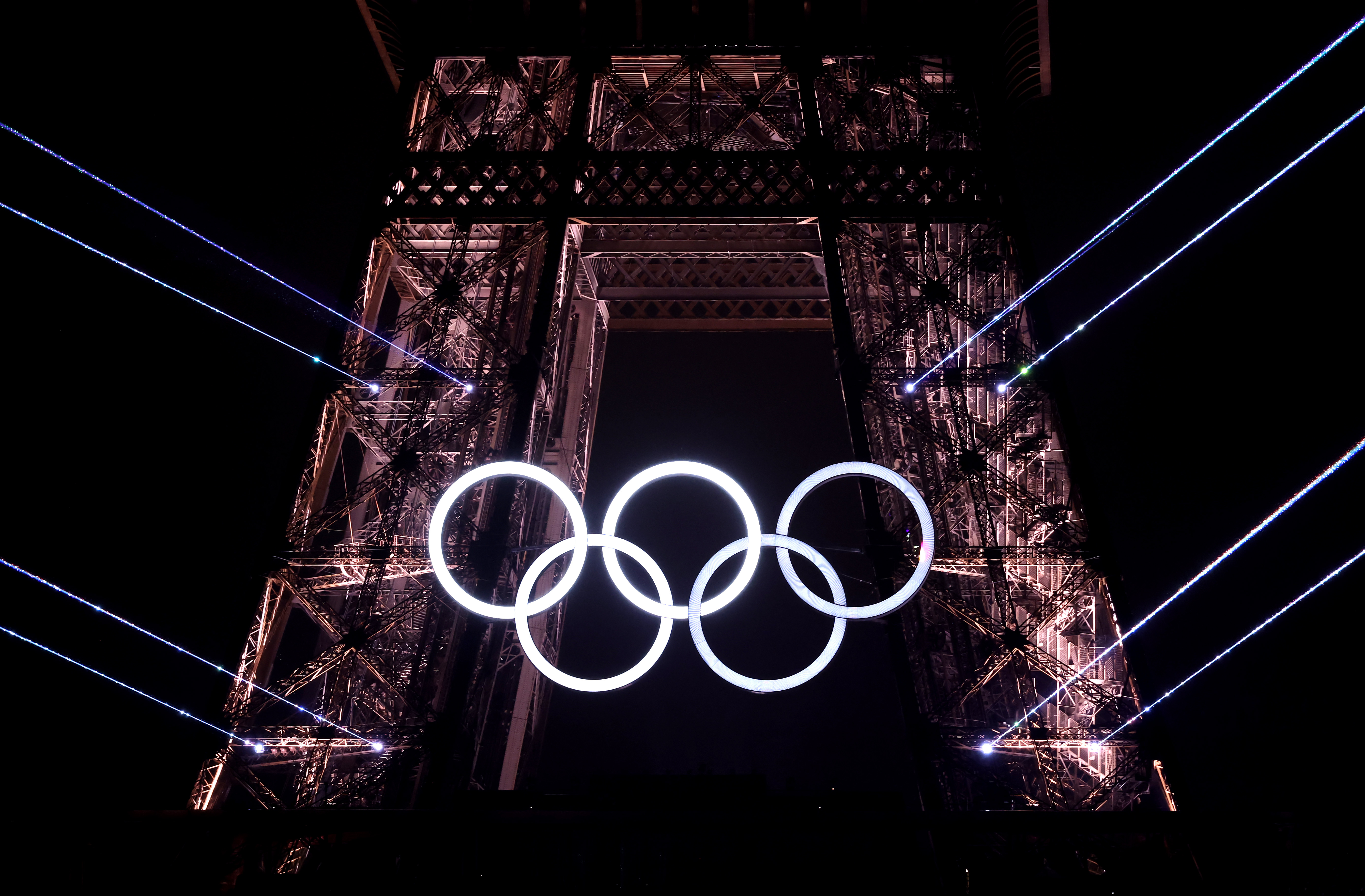 A Light Show takes place as The Olympic Rings on the Eiffel Tower are illuminated during the opening ceremony of the Olympic Games Paris 2024 at Place du Trocadero on July 26, 2024, in Paris, France | Source: Getty Images