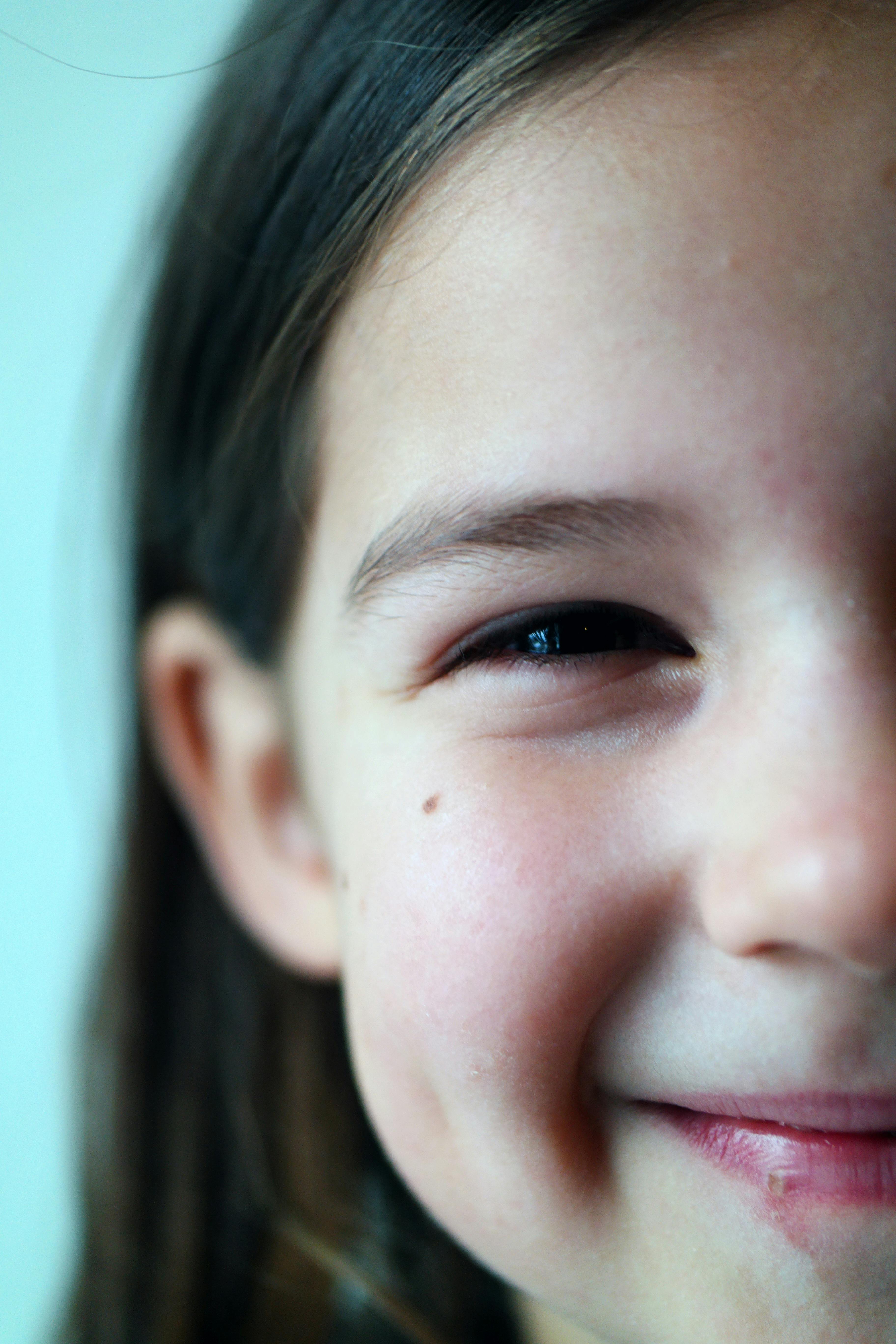 Cropped face of a happy little girl | Source: Pexels