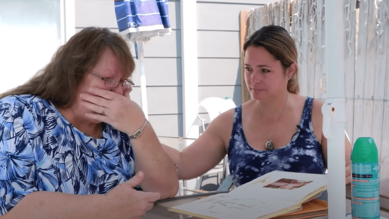 A mother is tearful as she looks at baby photos of the child that was stolen from her | Photo: Youtube/NBC News