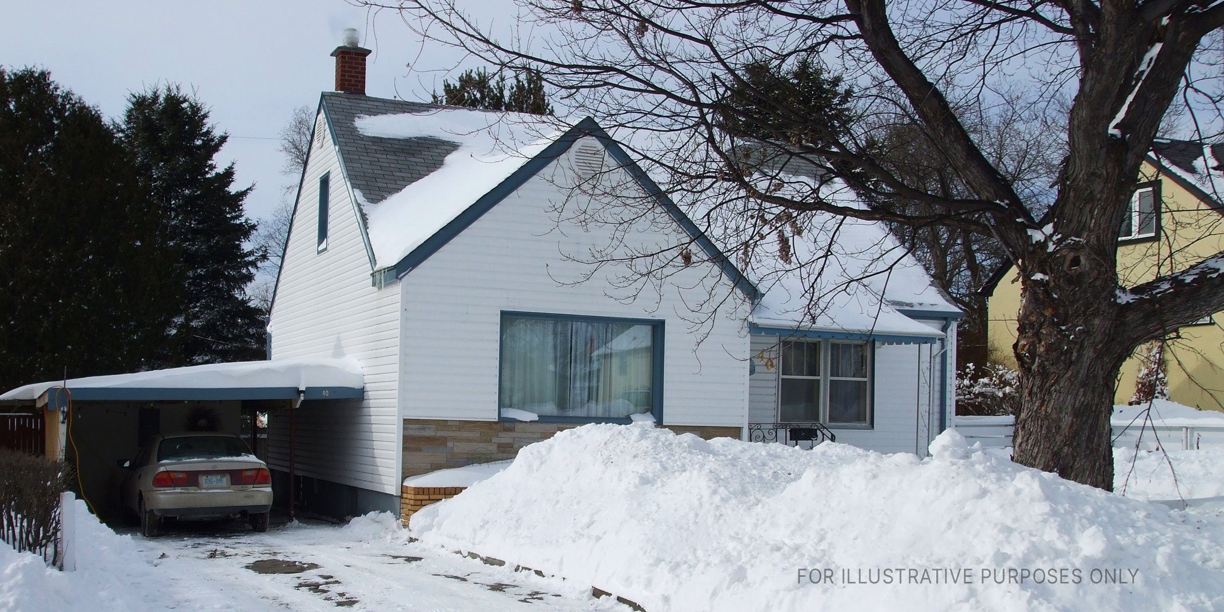 Snow covered house. | Source: Flickr / tachyondecay (CC BY 2.0)