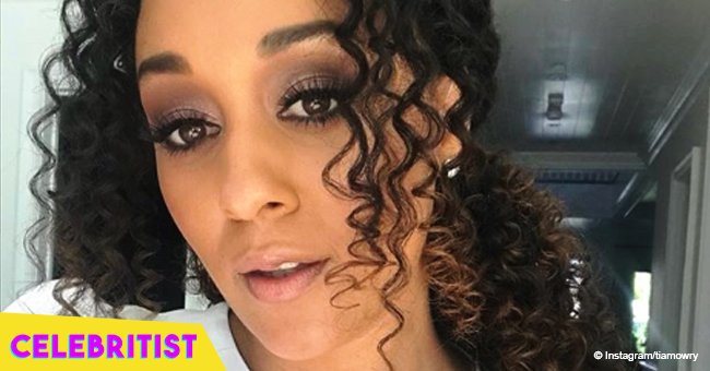 Tia Mowry stuns in black midi dress, posing with son & daughter wearing white outfit in photo