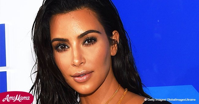 Kim Kardashian puts on a sizzling display as she reveals her cleavage in a very low-cut dress