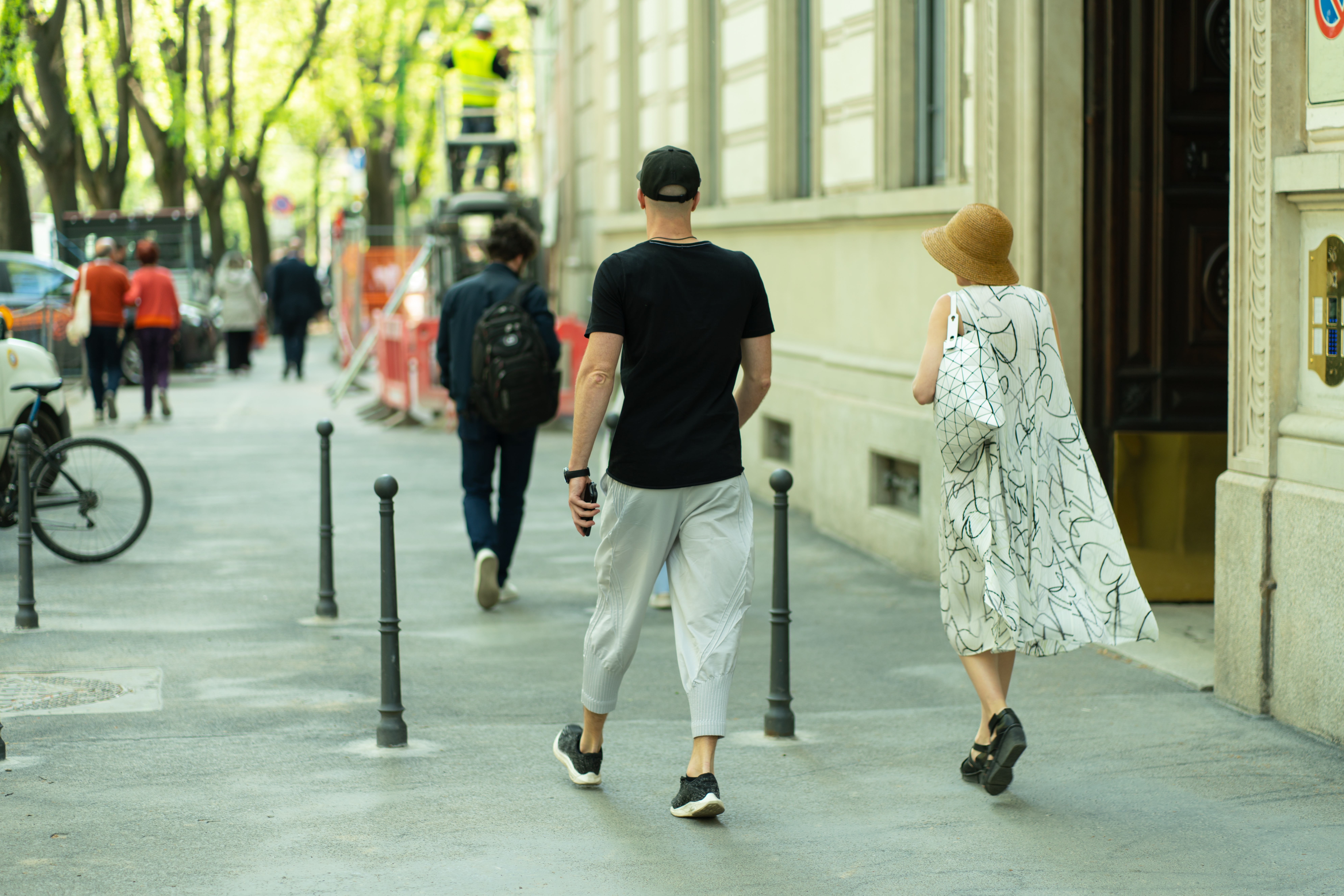 Couple walking down the street. | Source: Shutterstock