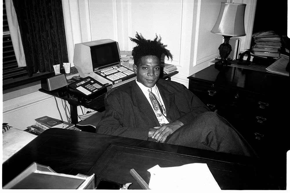 Jean-Michel Basquiat at the surprise birthday party for Susanne Bartsch at the Rainbow Roof, at Steven Greenberg's office, 30 Rockefeller Plaza on September 19, 1985. | Photo: Getty Images