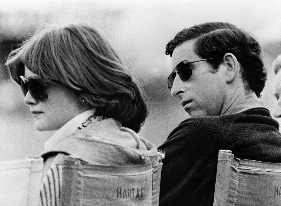 Prince Charles and Lady Sarah Spencer, the elder sister of Diana, whom he later married, watch a polo match at Windsor. | Source: Getty Images