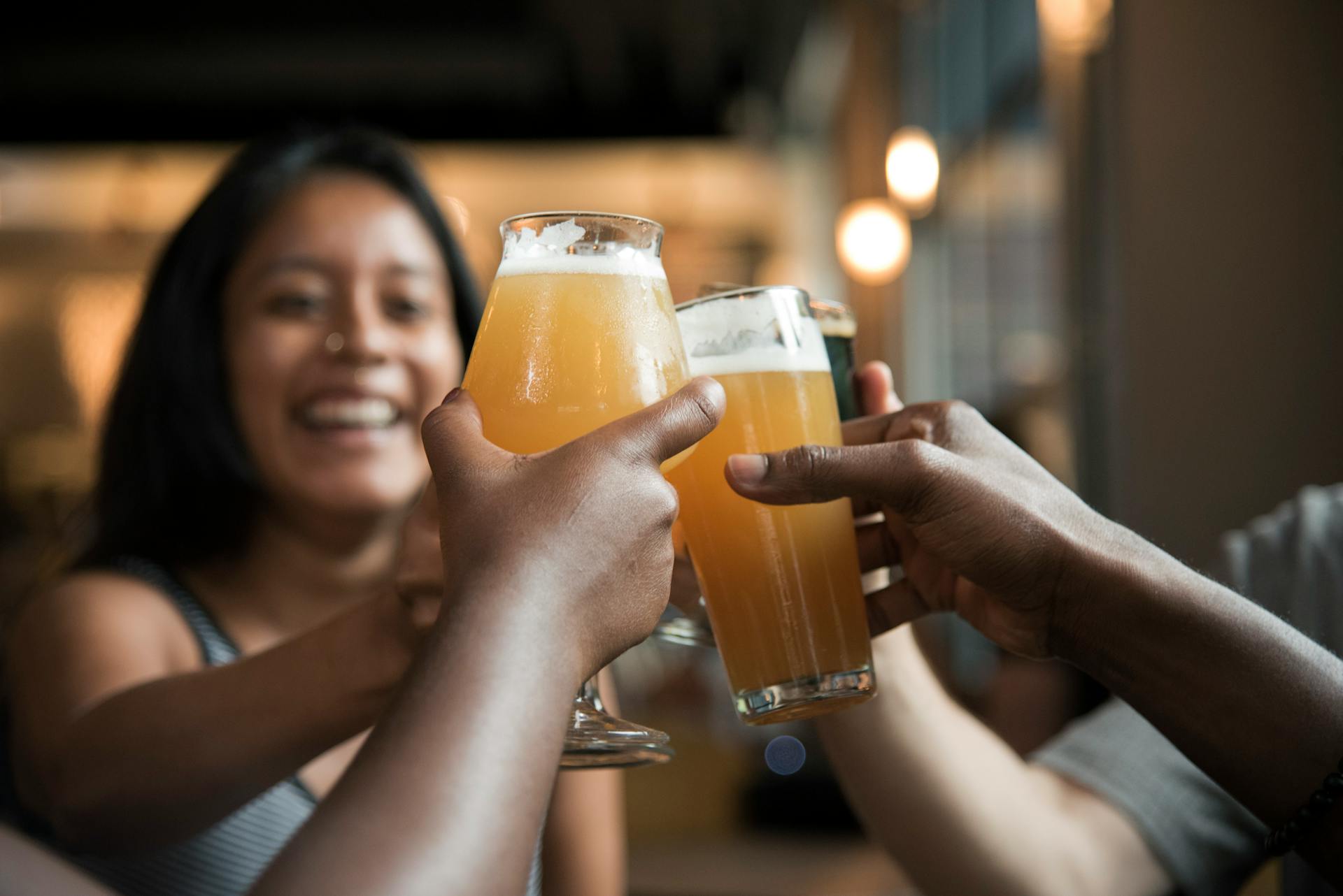 Friends celebrating in a bar | Source: Pexels