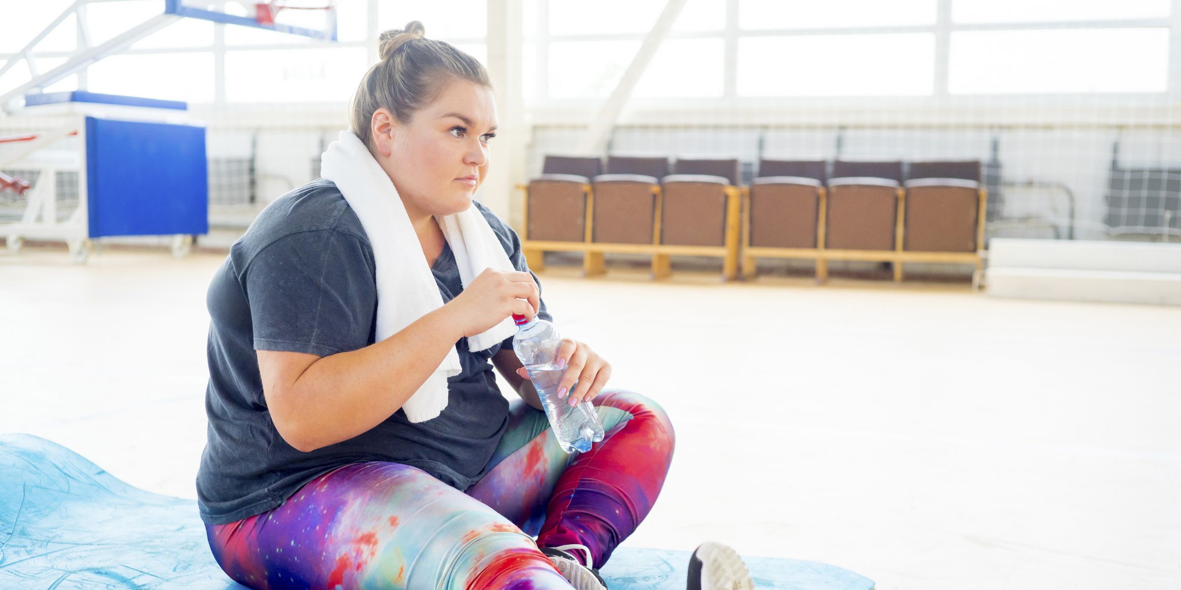A plus-size woman in a gym | Source: Shutterstock