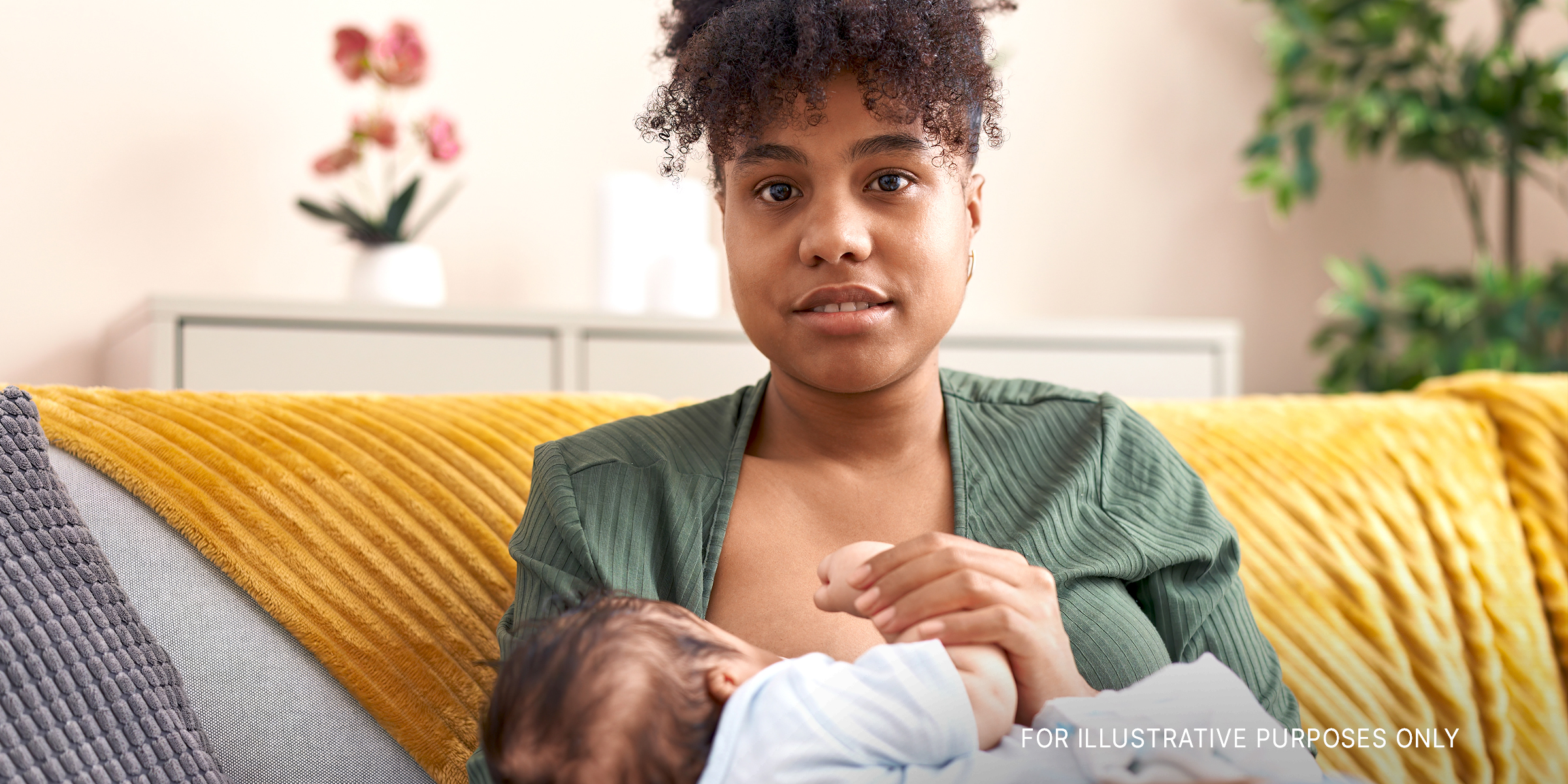 A woman feeding her baby | Source: Shutterstock