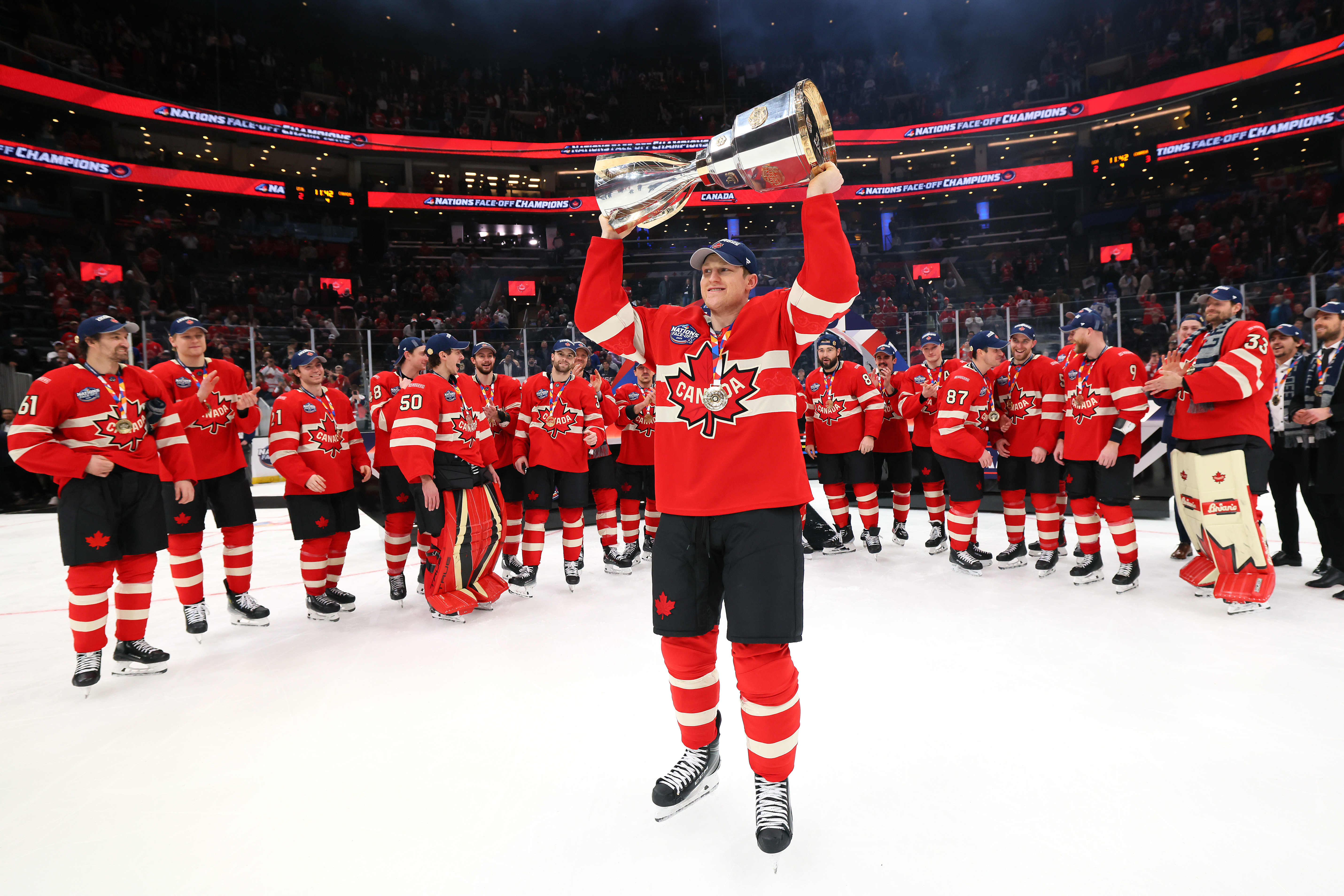 Nathan MacKinnon of Team Canada celebrates with teammates after an overtime win against Team USA in the NHL 4 Nations Face-Off final at TD Garden on February 20, 2025 | Soure: Getty Images