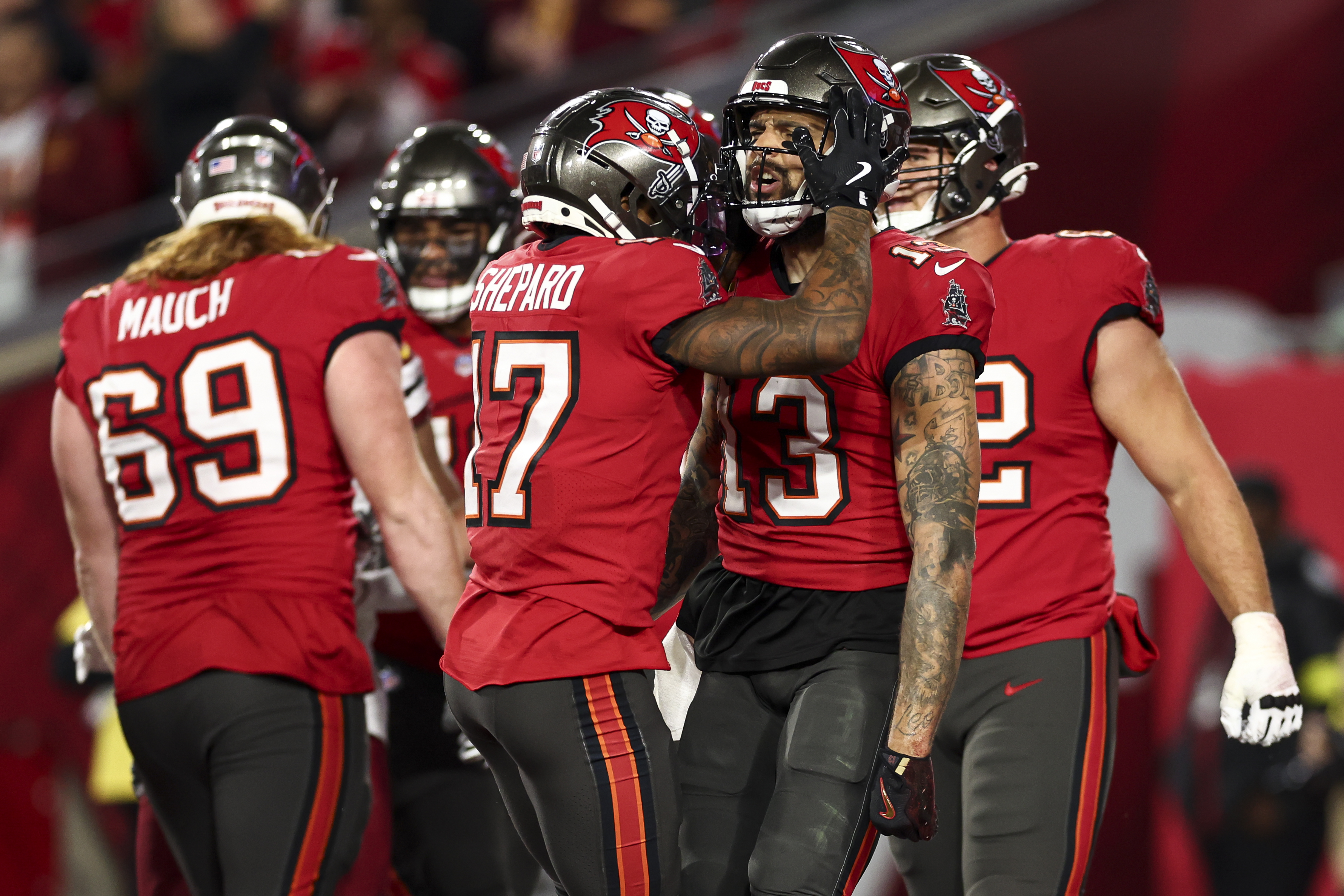 Mike Evans #13 of the Tampa Bay Buccaneers celebrates after scoring a touchdown against the Washington Commanders on January 12, 2025, in Tampa, Florida | Source: Getty Images