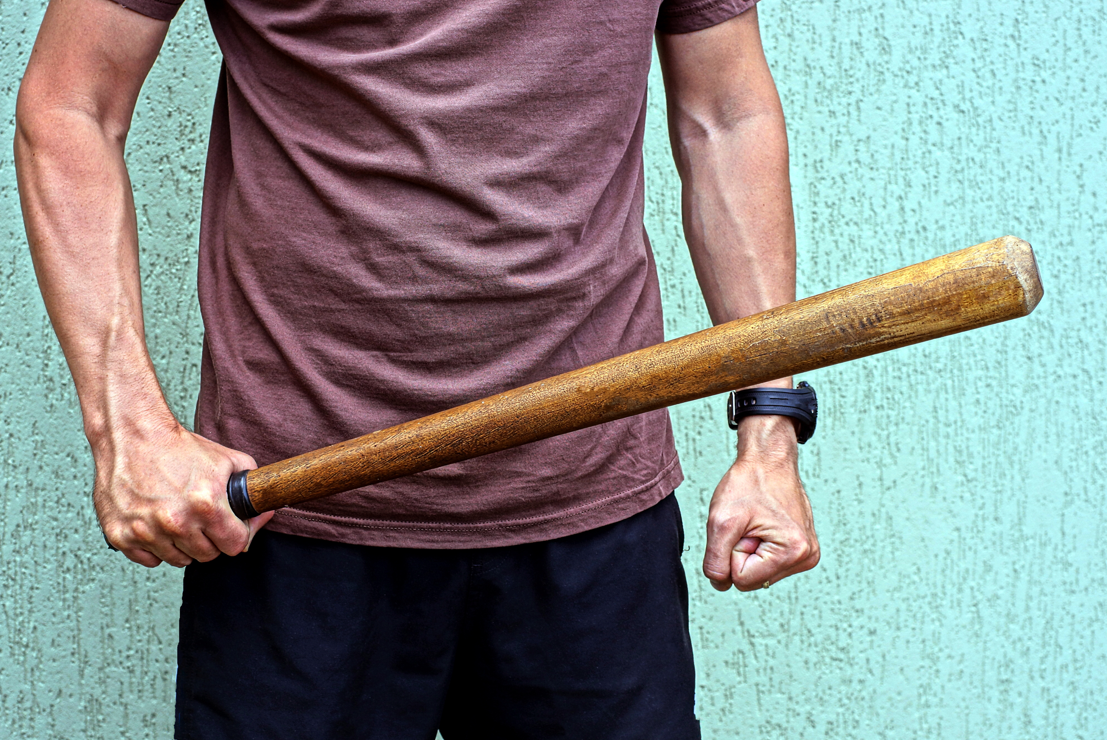 Man with a bat | Source: Shutterstock