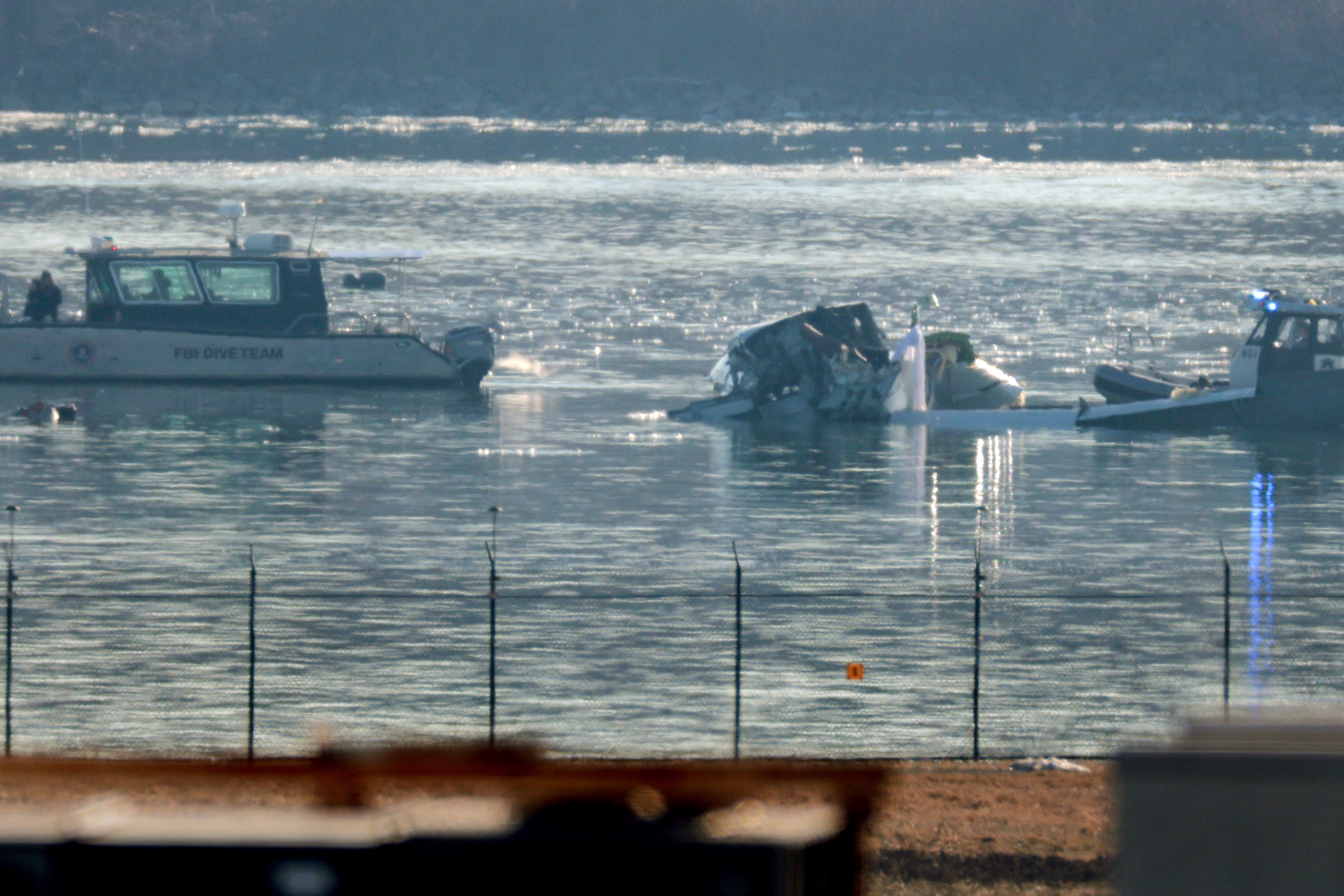 Emergency response units search the crash site of an American Airlines plane on the Potomac River after an accident while on approach to Reagan National Airport on January 30, 2025 | Source: Getty Images