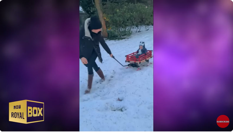 Meghan, Duchess of Sussex plays on the snow with Archie Harrison Mountbatten-Windsor from a YouTube video dated December 15, 2022 | Source: Youtube/@LMT