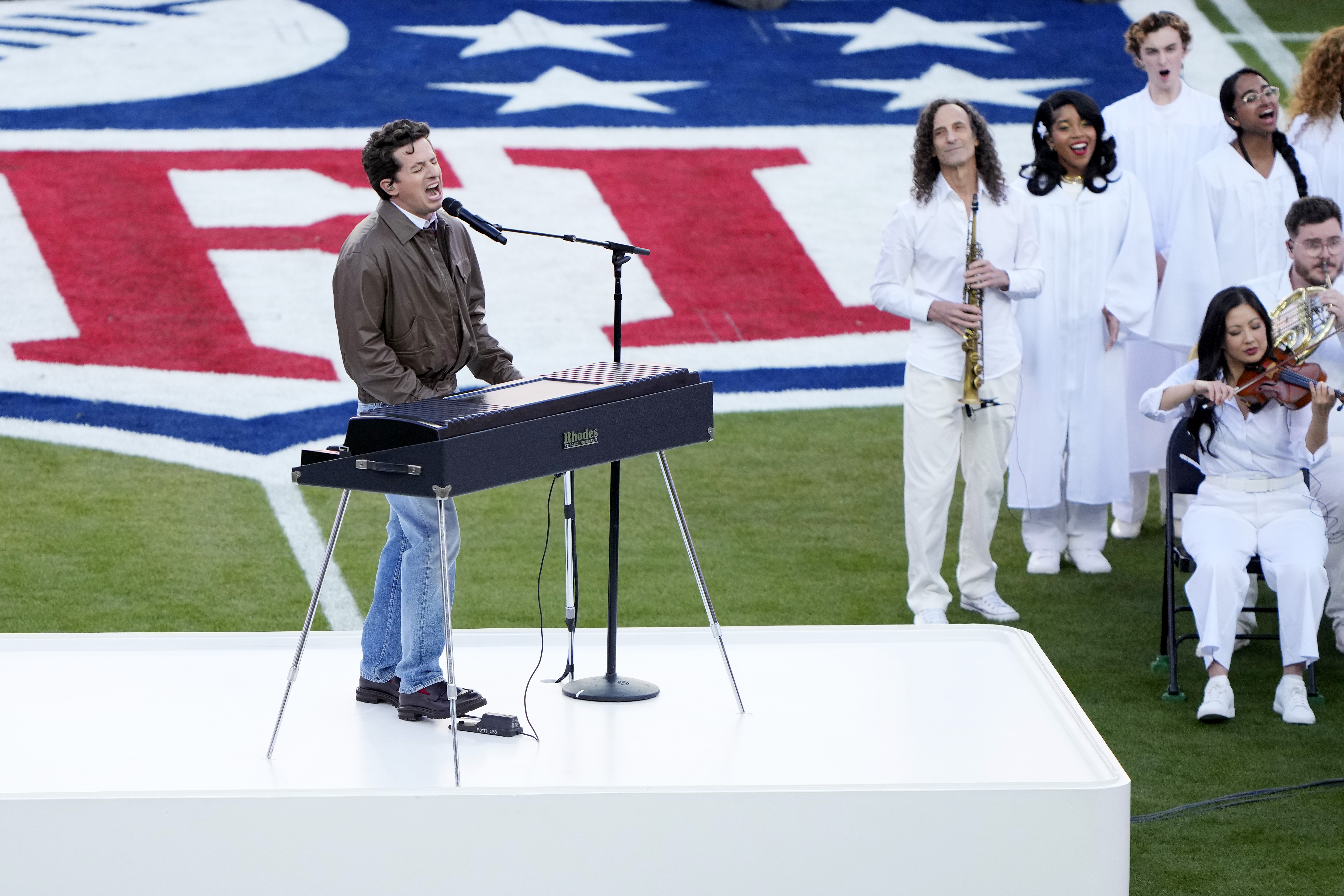 Charlie Puth sings the National Anthem during Super Bowl LX as musicians stand behind him at Levi's Stadium in Santa Clara, California, on February 8, 2026 | Source: Getty Imges