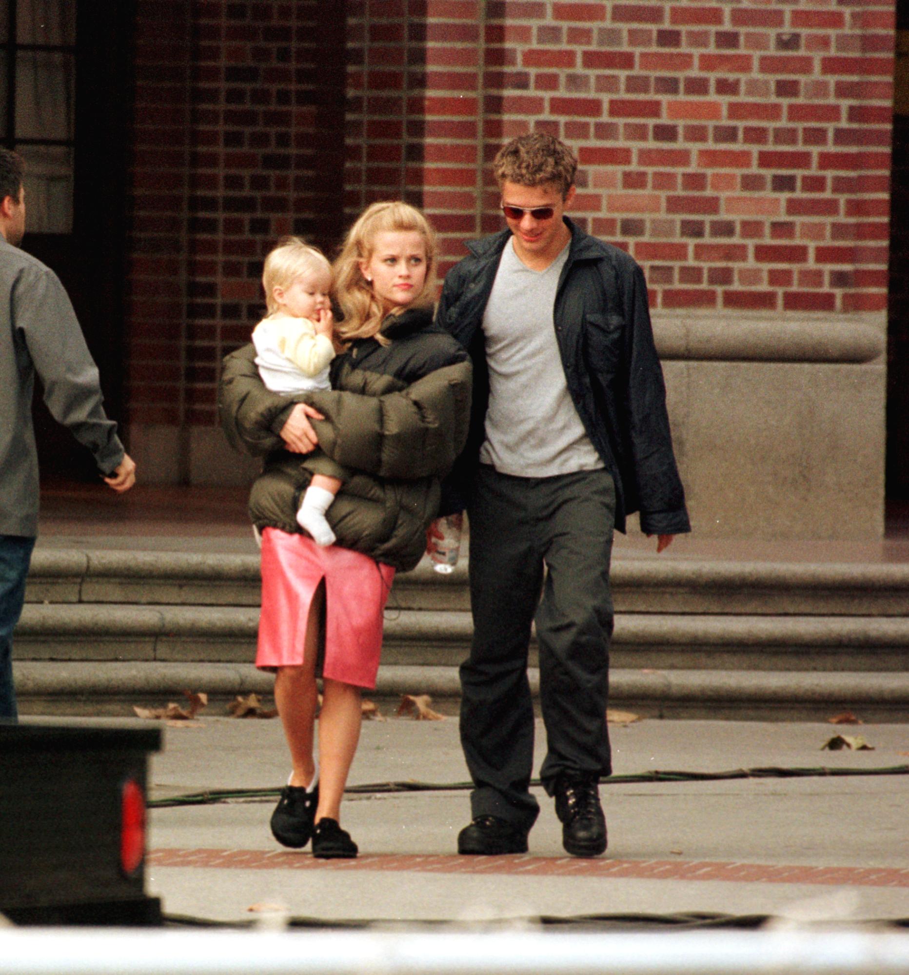Witherspoon is joined on the set of "Legally Blonde" by her husband Phillippe and their daughter Ava Elizabeth Phillippe on October 21, 2000, in Los Angeles, California. The trio walk and chat together, looking like the picture of a perfect young family.