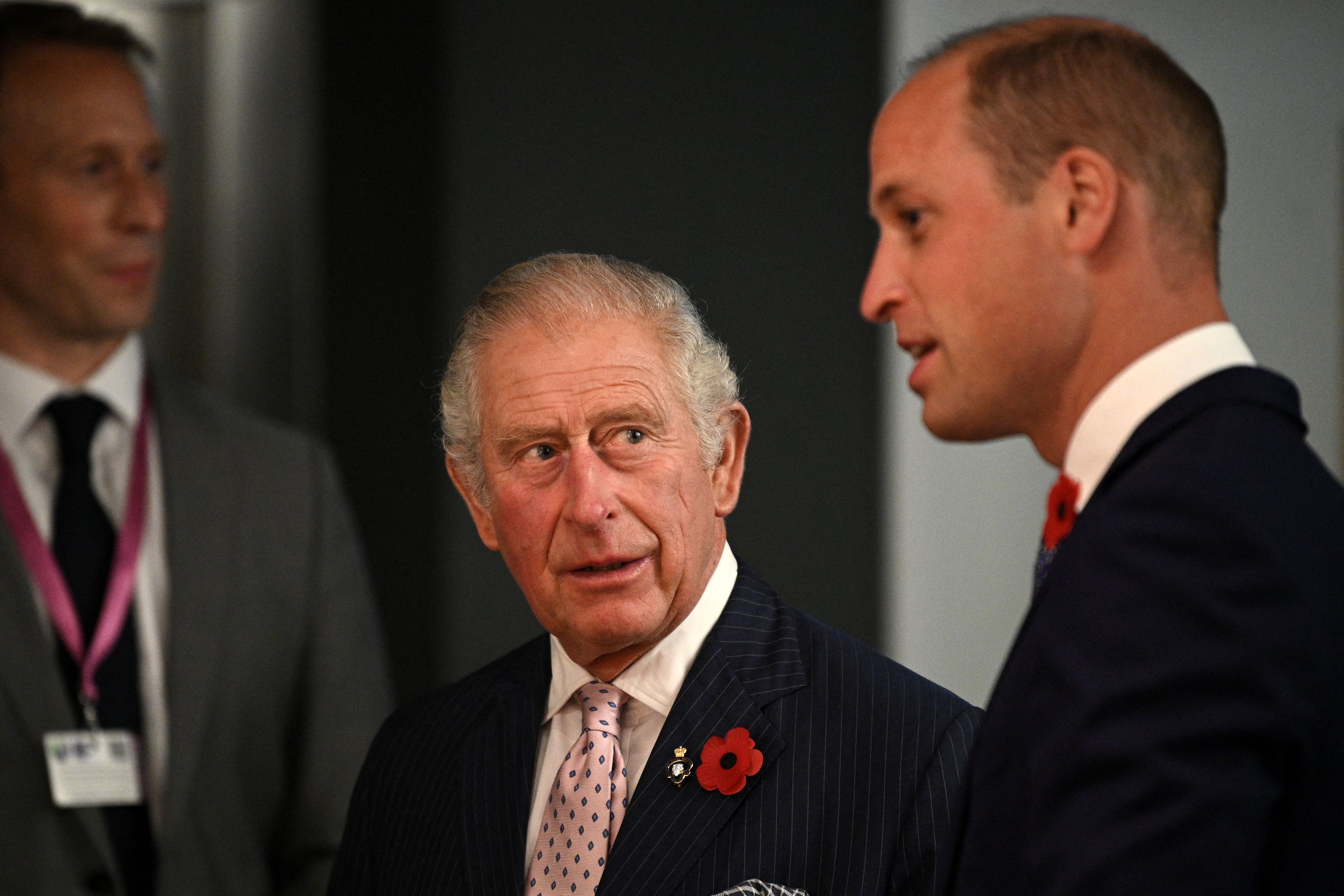 Britain's Prince Charles reacts as he speaks with Prince William at a reception for the key members of the Sustainable Markets Initiative and the Winners and Finalists of the first Earthshot Prize Awards in Glasgow, Scotland on November 1, 2021. | Source: Getty Images