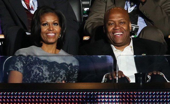 Michelle Obama sits with her brother Craig Robinson in a box during day two of the Democratic National Convention at Time Warner Cable Arena on September 5, 2012, in Charlotte, North Carolina. | Source: Getty Images.