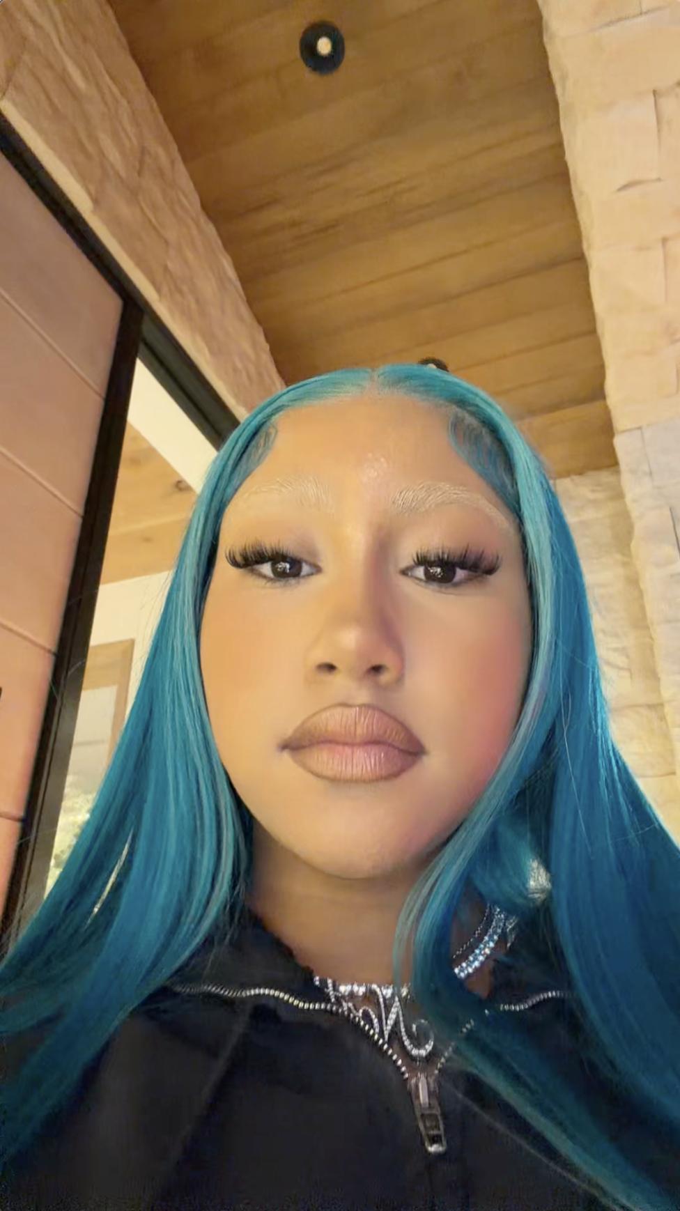 Close-up of North West with blue hair, nude lipstick, and sculpted brows | Source: TikTok/kimandnorth