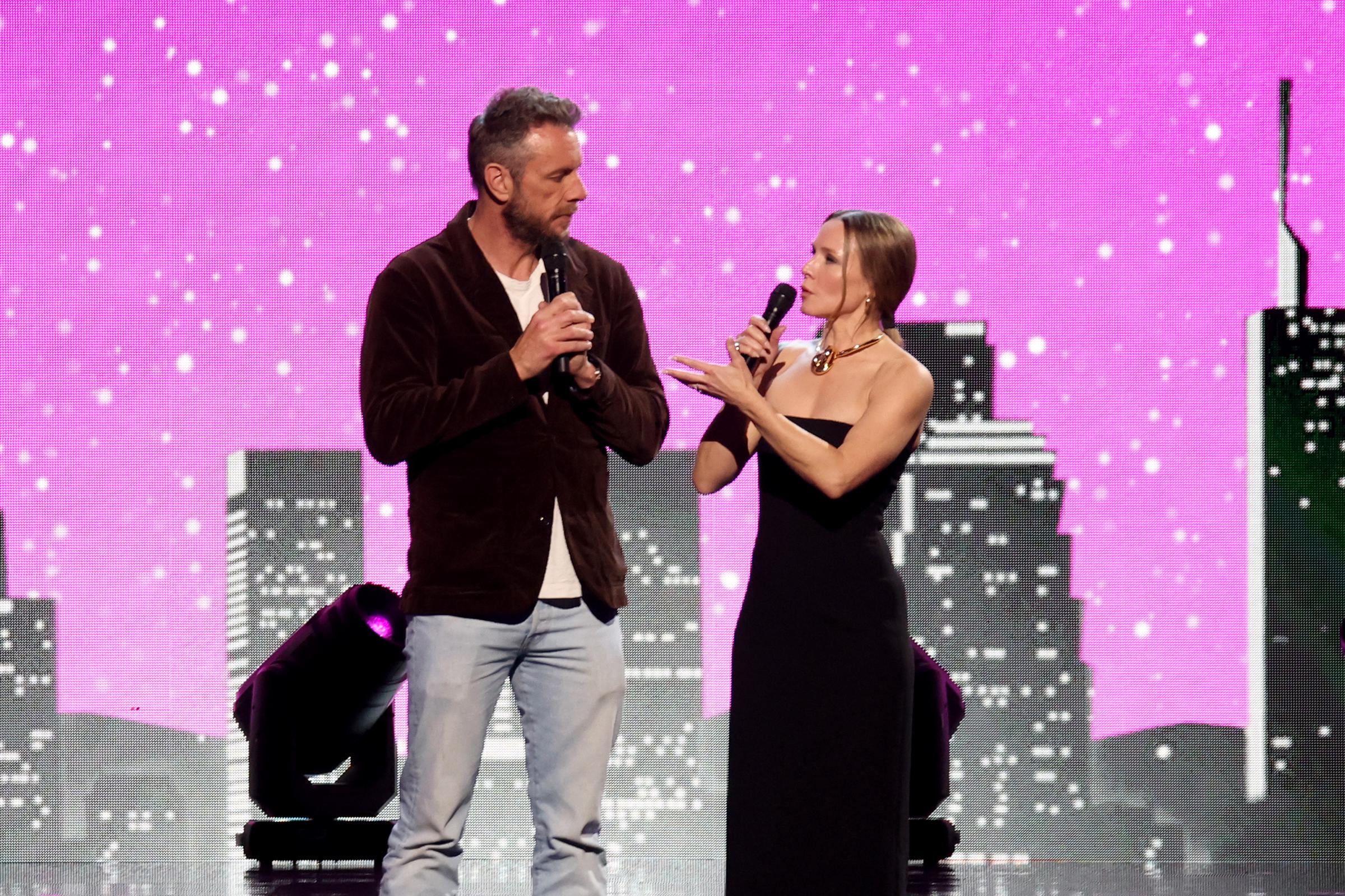 Kristen Bell speaks to her husband Dax Shepard onstage as Keep Memory Alive hosts star-studded lineup at annual "Power Of Love" gala at MGM Grand Garden Arena in Las Vegas, Nevada on February 22, 2025 | Source: Getty Images