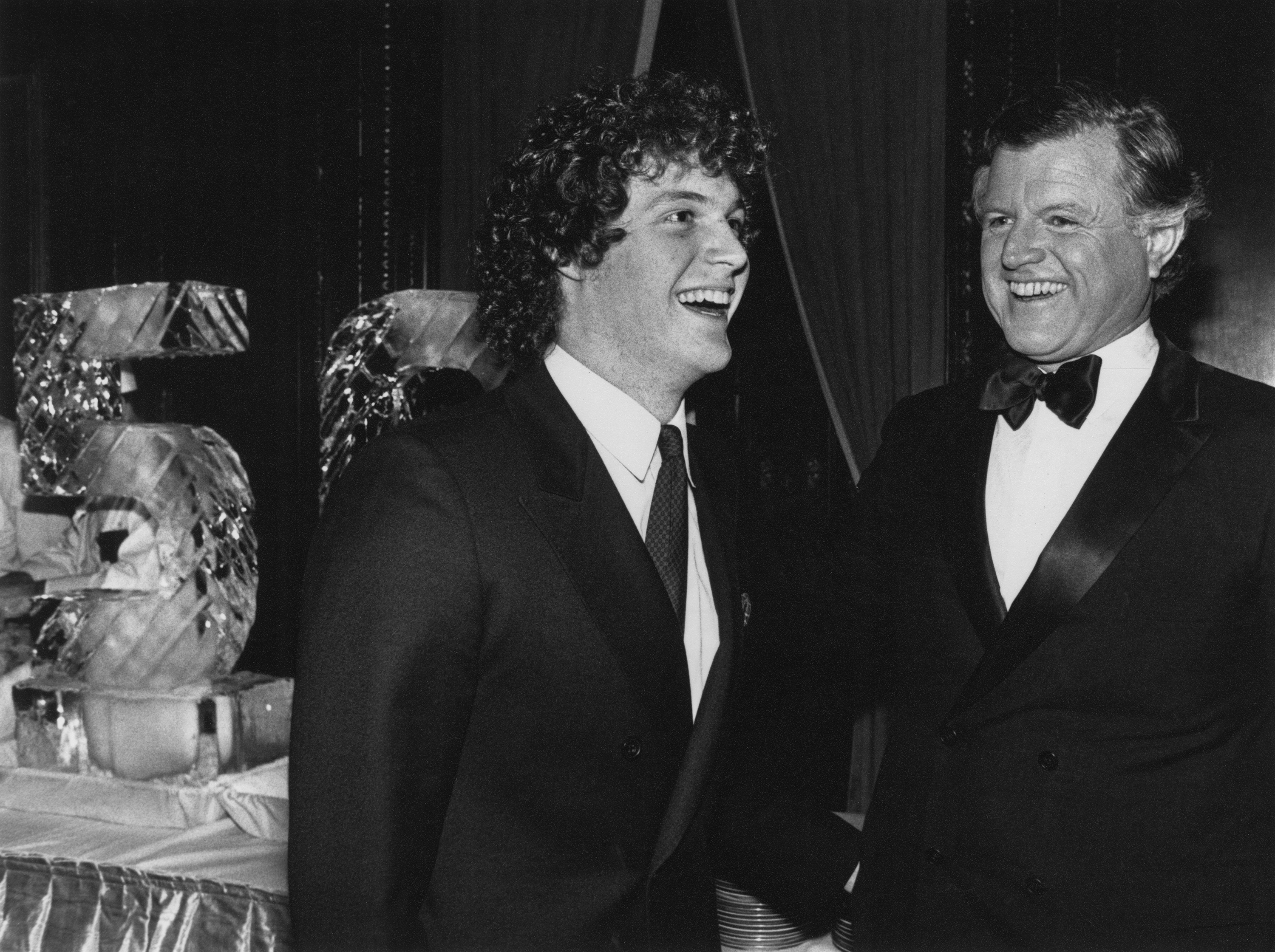 Senator Edward M Kennedy shares a laugh with his son, Edward M Kennedy, Jr at a black tie event in 1979 | Source: Getty Images