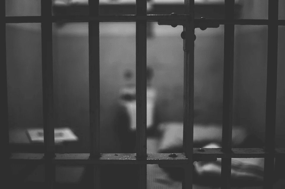 A portrait showing the iron bars of a prison cell | Photo: Pixabay