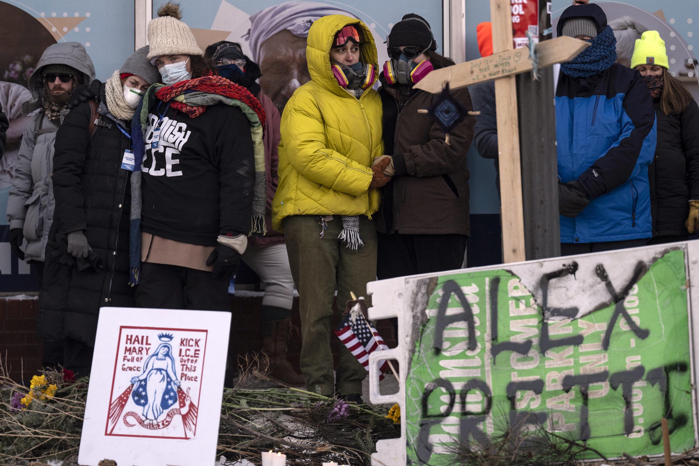 People mourn at a makeshift memorial in the area where Alex Pretti was shot dead in Minneapolis, Minnesota, on January 24, 2026. | Source: Getty Images